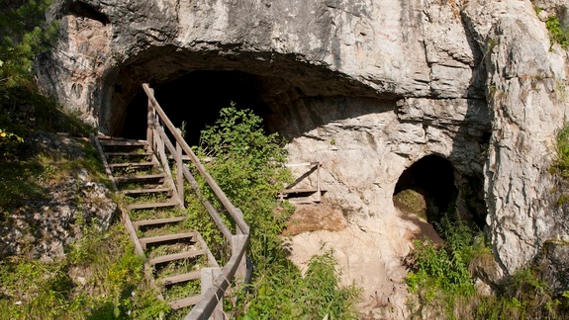 The existence of this archaic human group came to light in 2010 when DNA from a piece of a finger bone and two molars that were excavated at Denisova Cave in the Altai Mountains of southern Siberia was studied. Shown here, the entrance to the c
