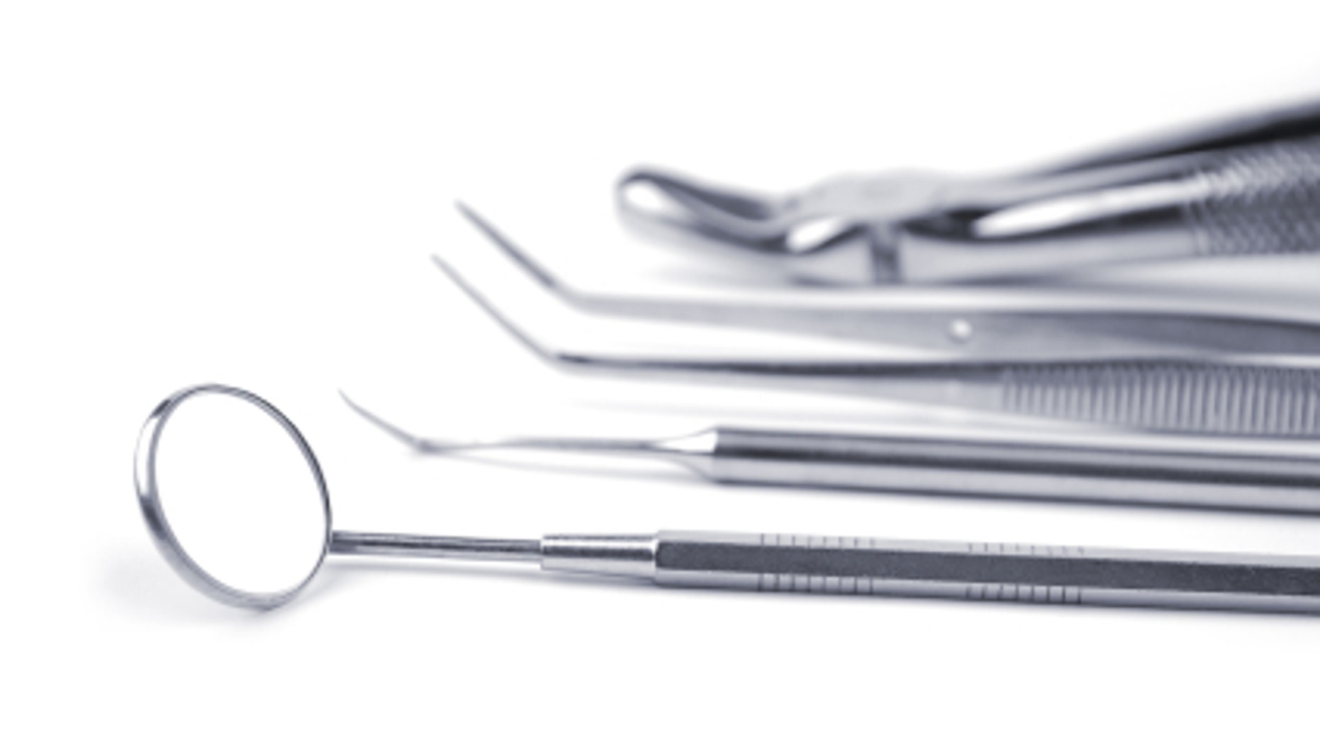 Dental tools on a white background. Selective focus.