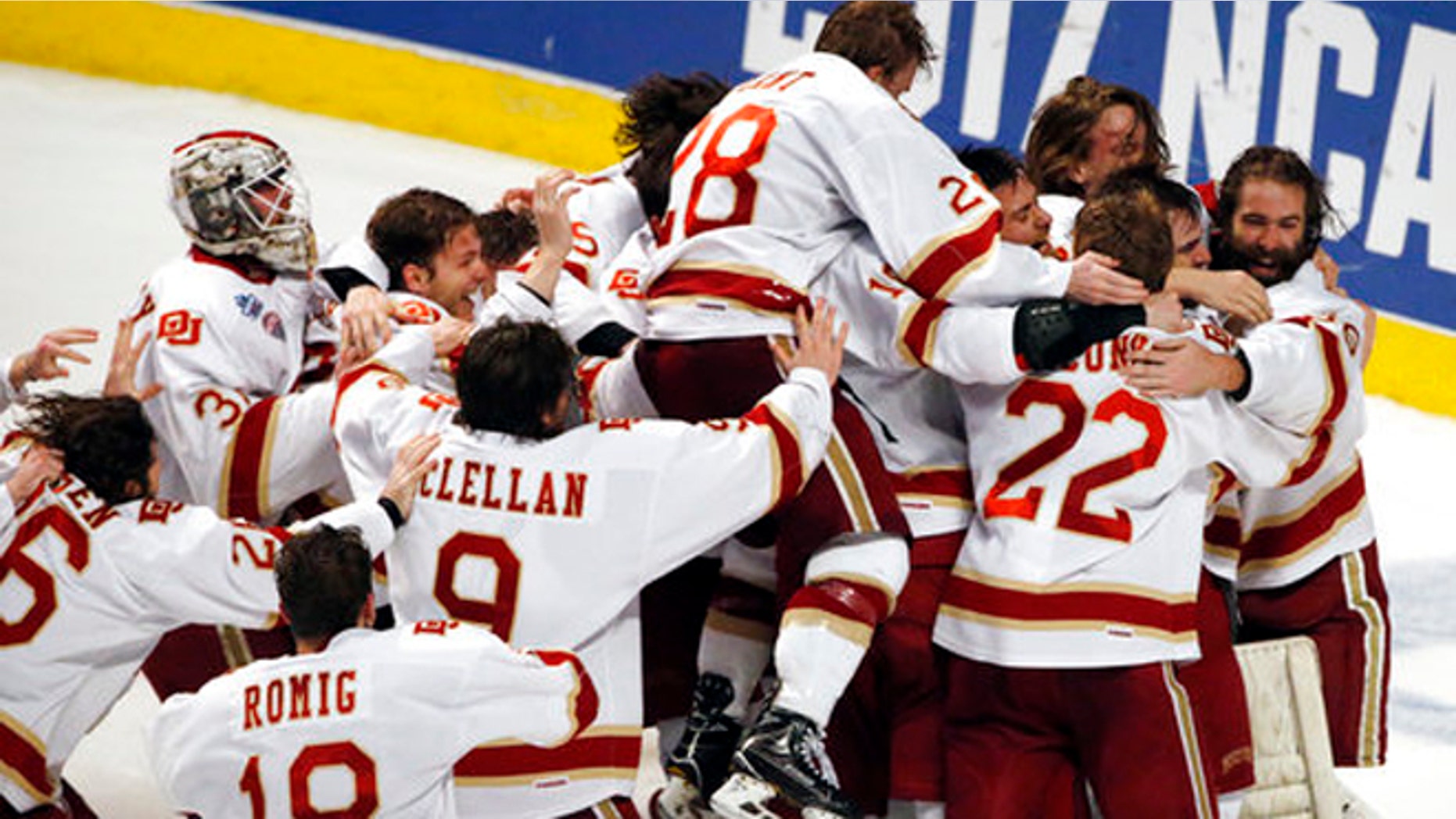 Denver players celebrate their 3-2 win over Minnesota Duluth during an NCAA Frozen Four championship college hockey game, Saturday.