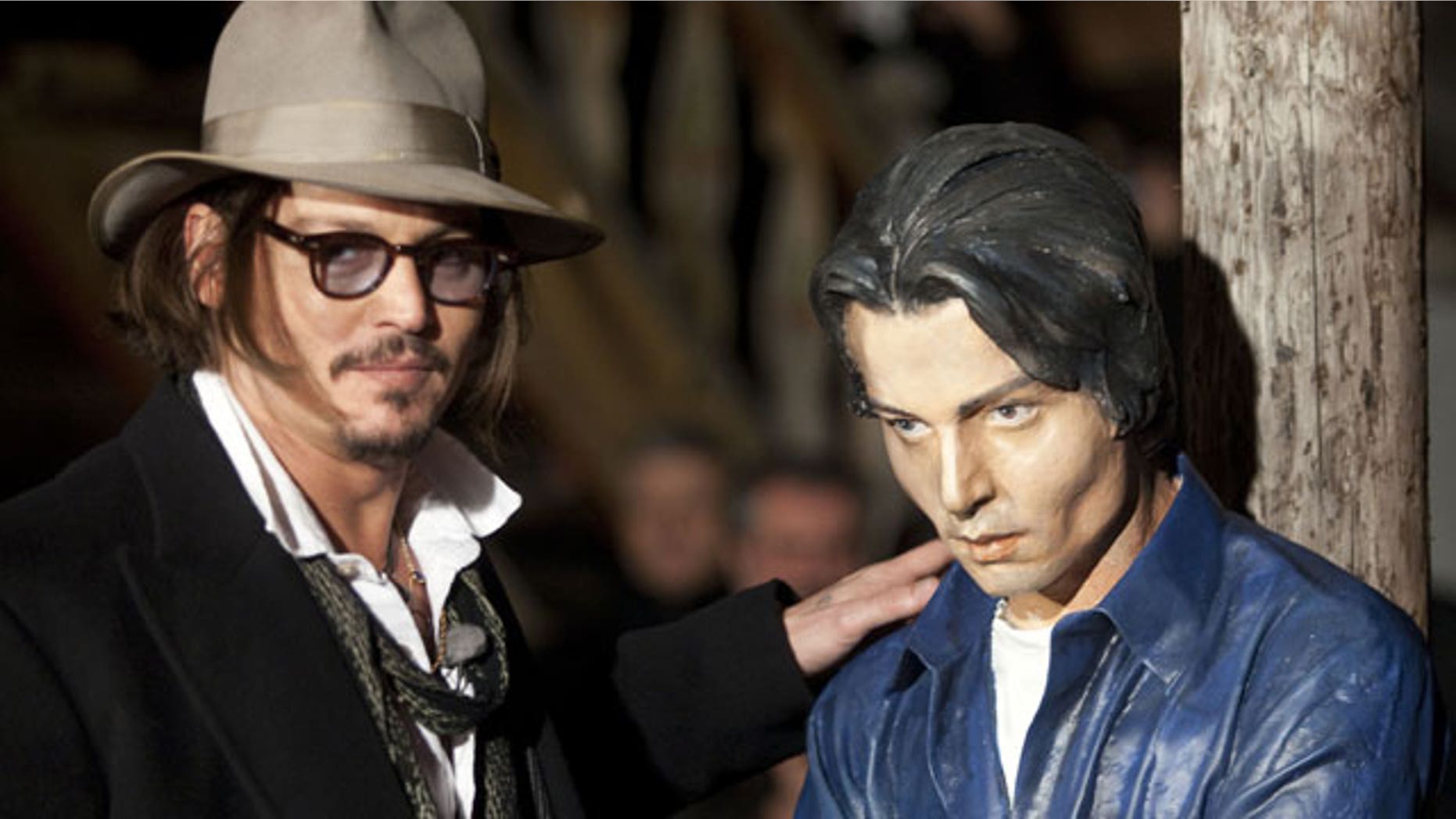 Depp hangs out with a Depp statue in Germany. (Reuters)