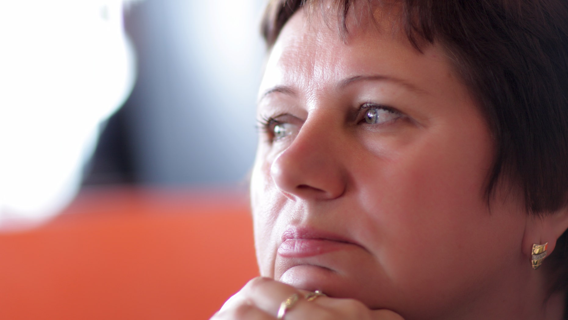 It is portrait of pensive mature woman indoor