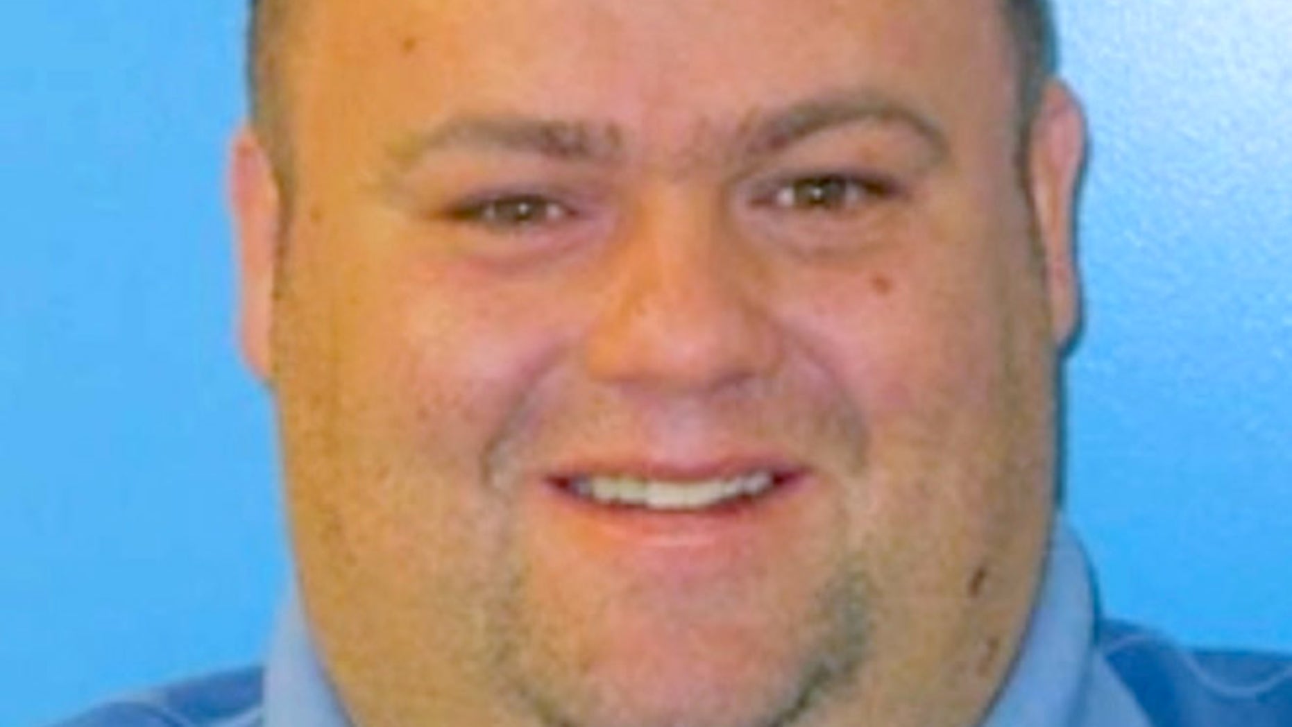 This undated photograph provided by the Park County, Colo., Sheriff's Department of Nate Carrigan, a corporal with the department who was shot and killed while serving an eviction notice with other officers to a man in Bailey, Colo.