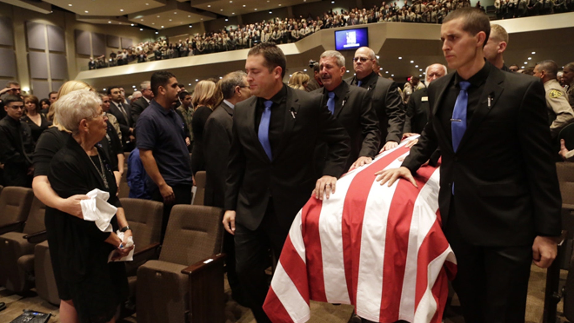 Thousands of law enforcement officials and members of the community gather for a memorial service of slain Los Angeles County Sheriff's Sgt. Steve Owen at Lancaster Baptist Church Thursday, Oct.13, 2016 in Lancaster, Calif.