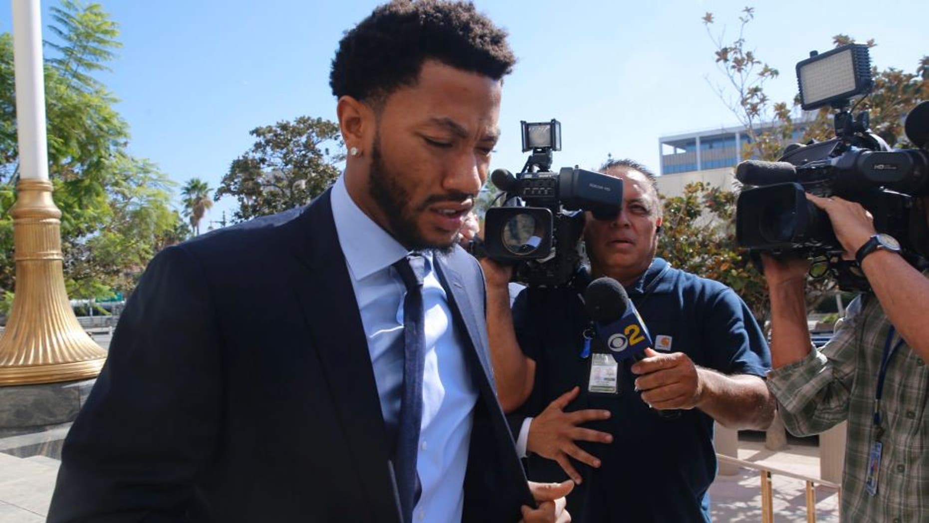 FILE - In this Thursday, Oct. 6, 2016, file photo, New York Knicks basketball player Derrick Rose arrives at U.S. District Court in downtown Los Angeles. The lawsuit alleging NBA star Rose and his friends raped an incapacitated woman is all about consent. Jurors who return to court Tuesday, Oct. 18, for the civil trial will have to determine whether the woman agreed to sex or was too incapacitated to do so. (AP Photo/Damian Dovarganes, File)