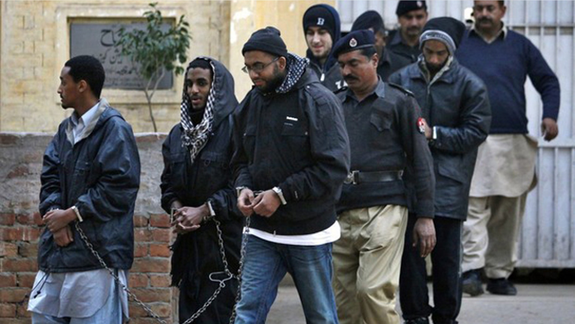 Pakistani police say the five men contacted the Taliban over the Internet and plotted attacks.