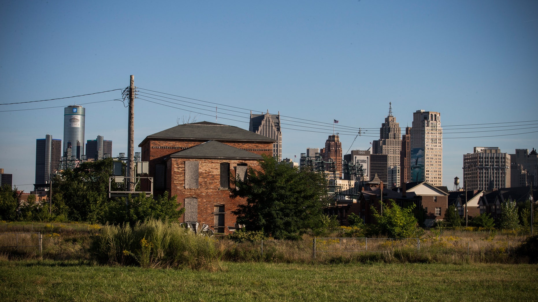 An abandoned home is seen with the Detroit skyline in the background on September 5, 2013 in Detroit, Michigan.