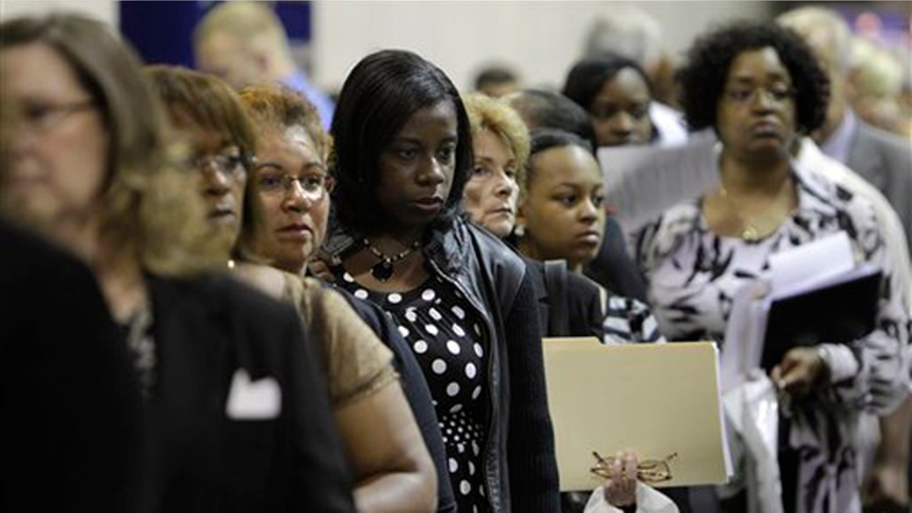 In this Aug. 25 photo, job seekers attend a job fair in Southfield, Mich. (AP Photo)