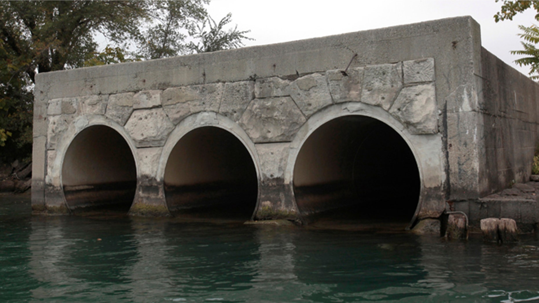 FILE: A view of the outfall pipes from The City of Detroit Water and Sewerage Wastewater Treatment Plant are seen along the Detroit River in Detroit. In bankruptcy and looking for cash, Detroit would like to lease its water utility to raise as much as $9 billion to fund basic services long term.