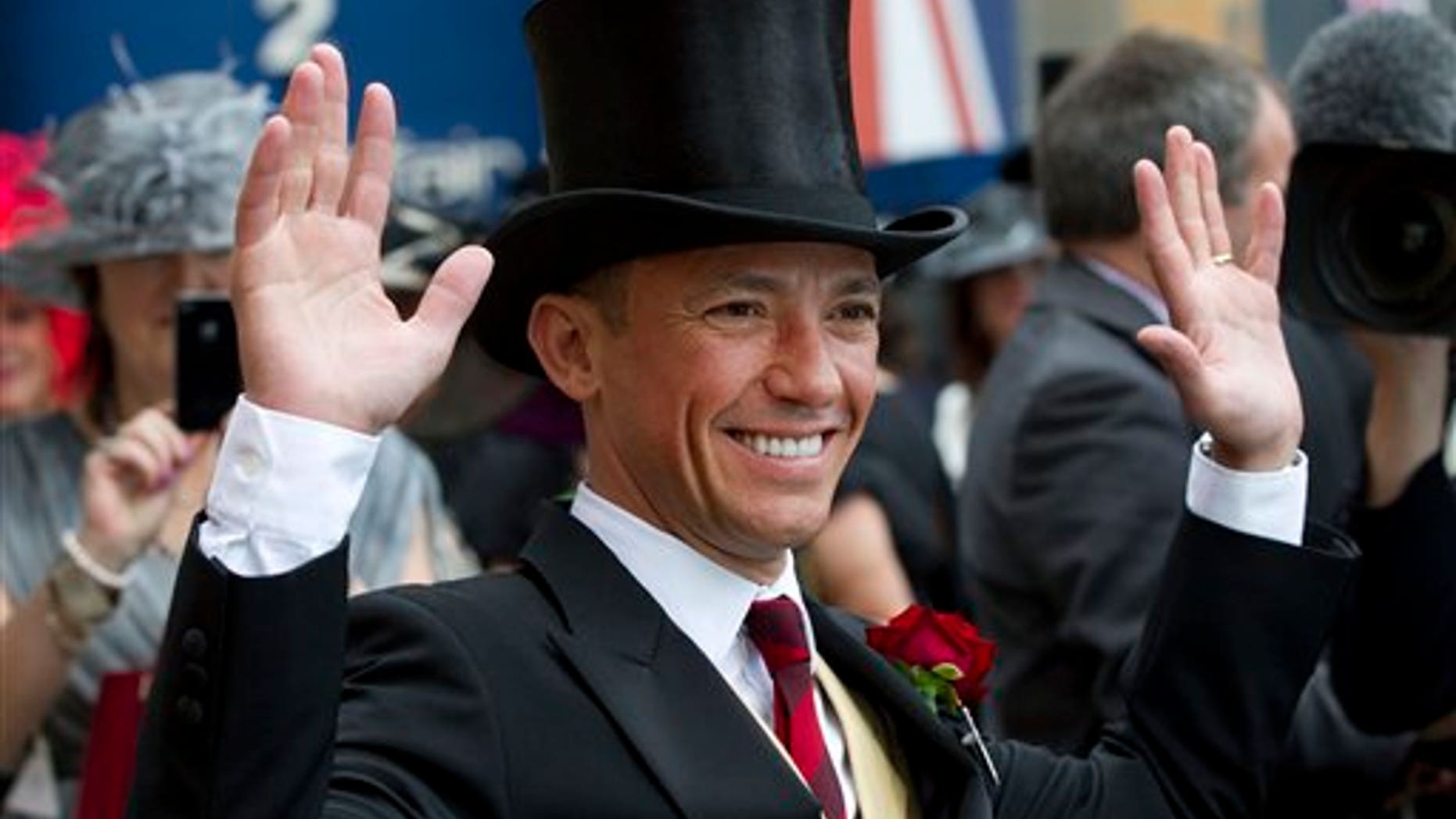 June 20, 2012: In this photo Italian jockey Frankie Dettori poses for the cameras on the second day of Royal Ascot horse race meeting at Ascot, England.
