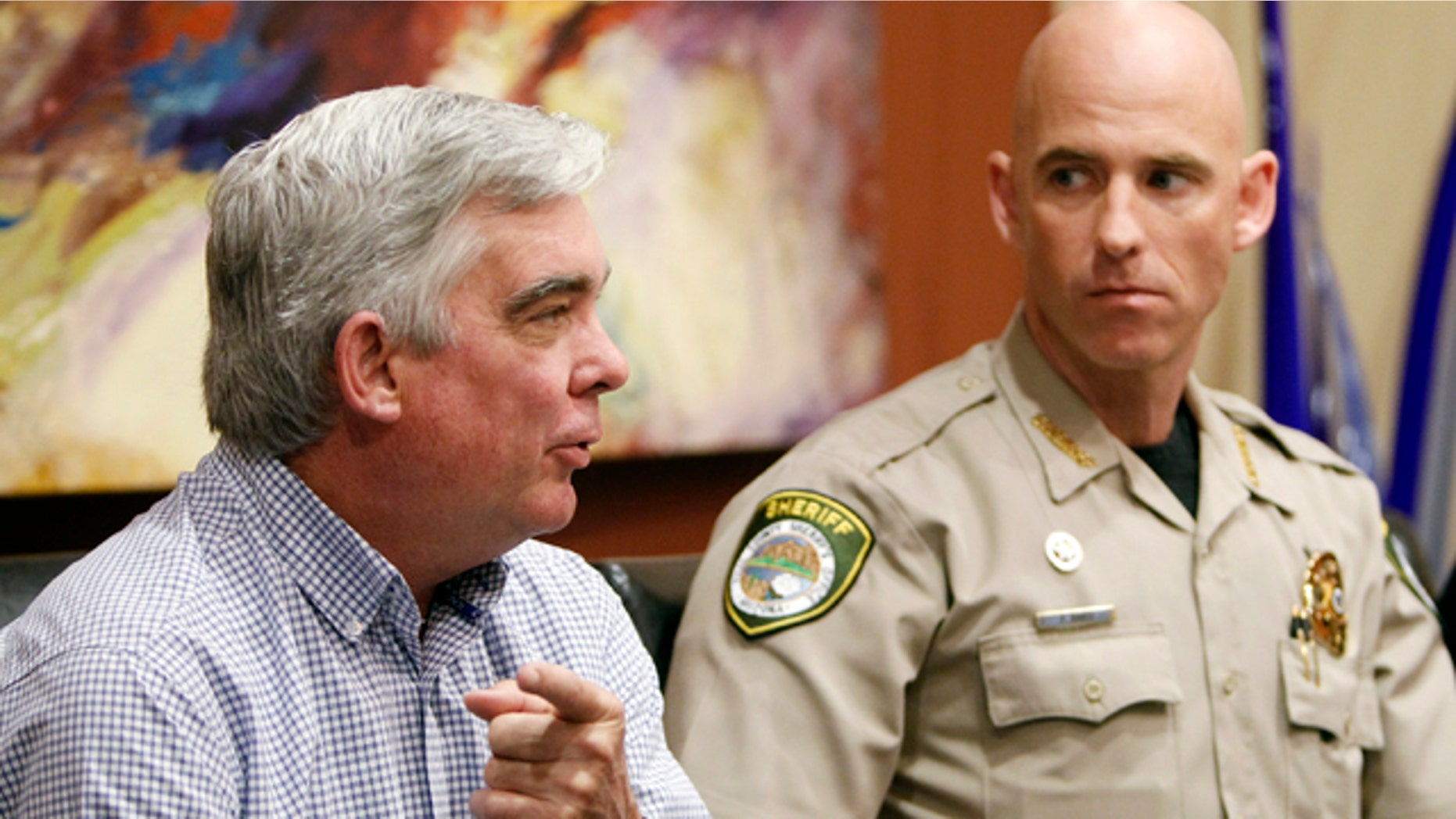 Nov. 1, 2010: Cochise County Sheriff Larry Dever, left, speaks about illegal immigration at an event in Arizona also attended by Pinal County Sheriff Paul Babeu.