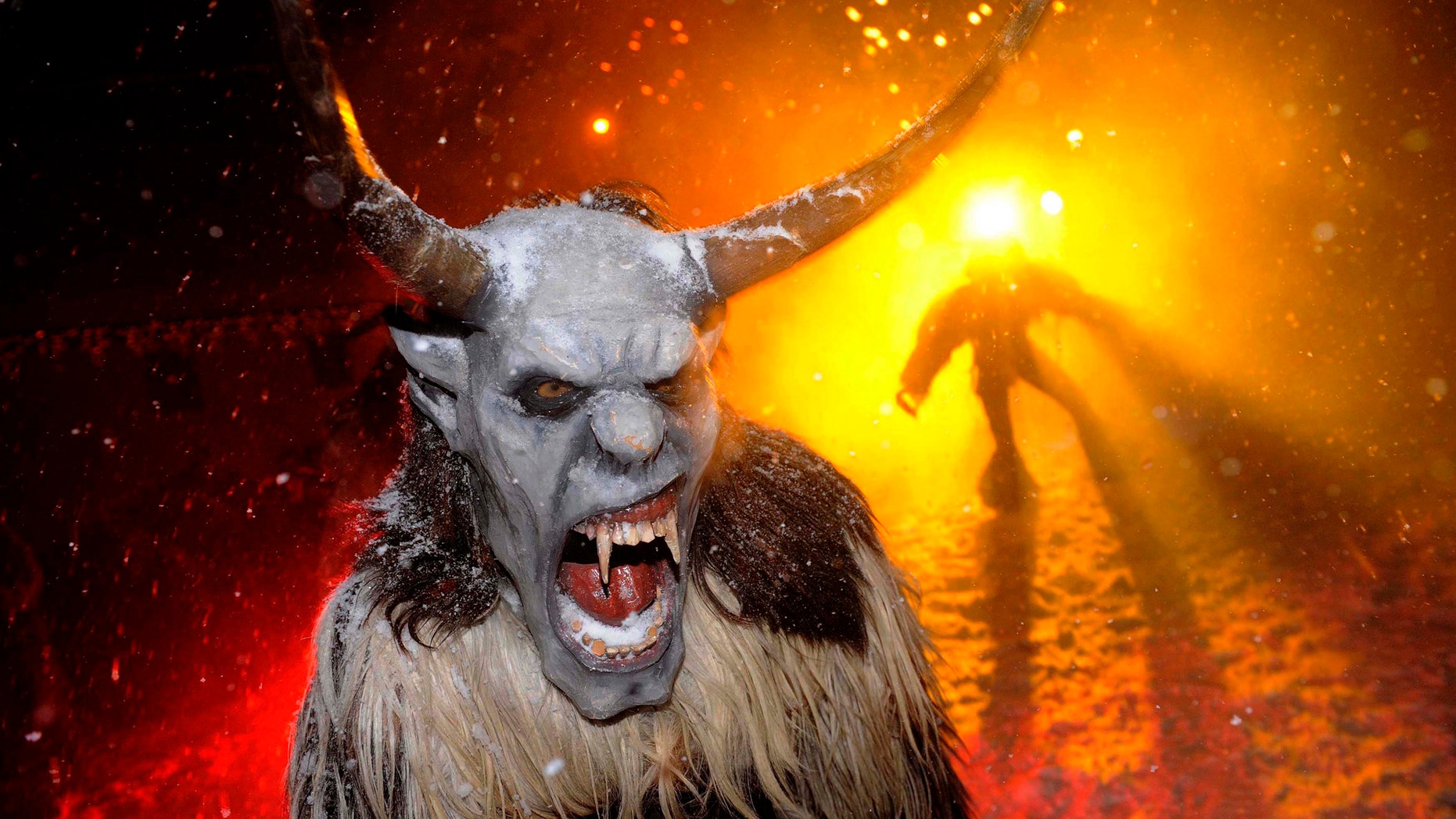 File photo - Actors dressed as devils perform during the "gathering of the devils" ahead of Saint Nicholas Day in Podkoren December 1, 2010. (REUTERS/Bor Slana)