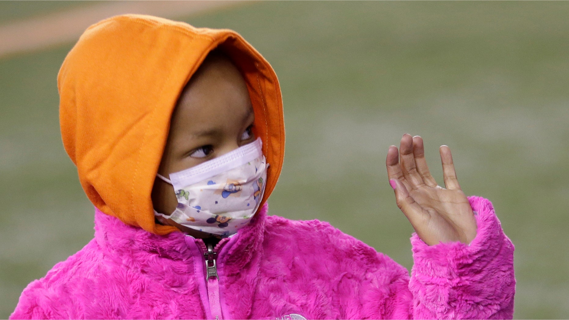 Nov. 6, 2014: Leah Still waves during a ceremony in the first half of an NFL football game between the Cincinnati Bengals and the Cleveland Browns