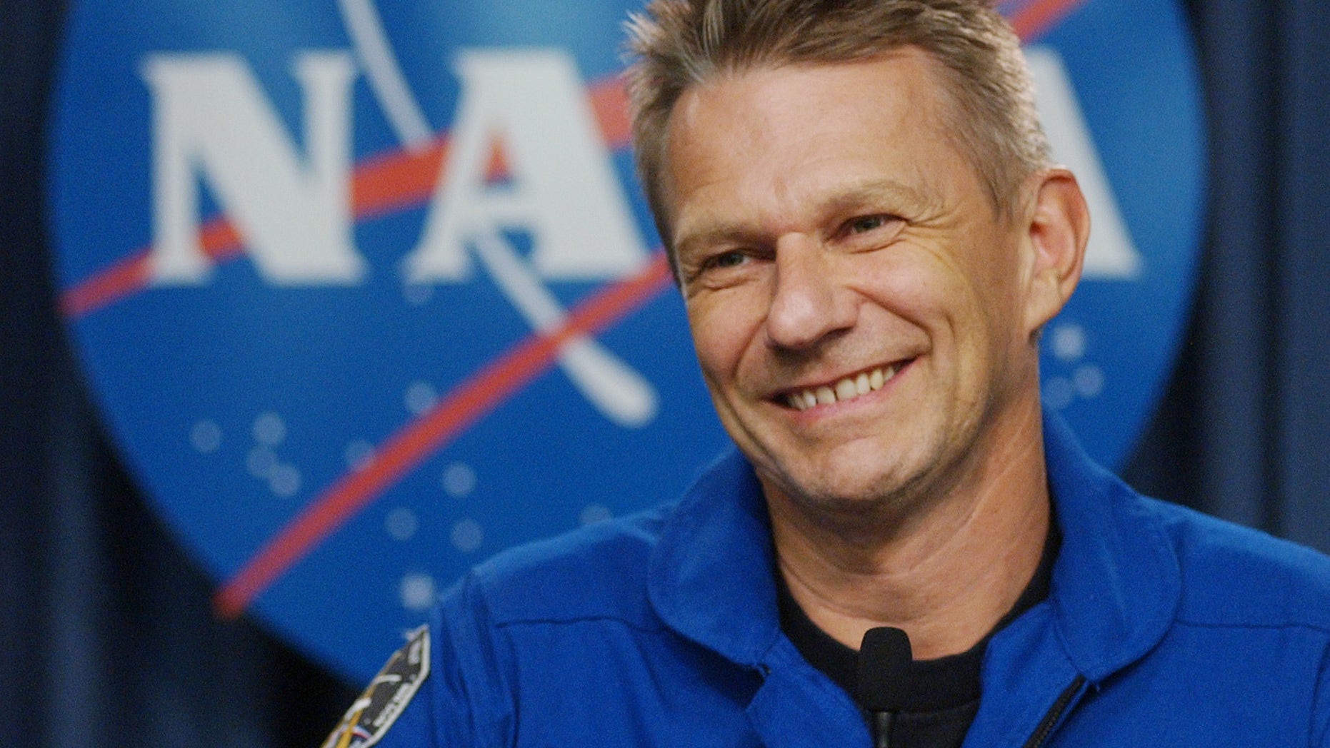 FILE - In this July 17, 2006 photo, British born U.S. Astronaut Piers Sellers talks with reporters following the safe return the space shuttle Discovery at the Kennedy Space Center in Cape Canaveral, Fla. Sellers, a climate scientist and former astronaut died Friday, Dec. 23, 2016. He was 61. (AP Photo/Pete Cosgrove, File)