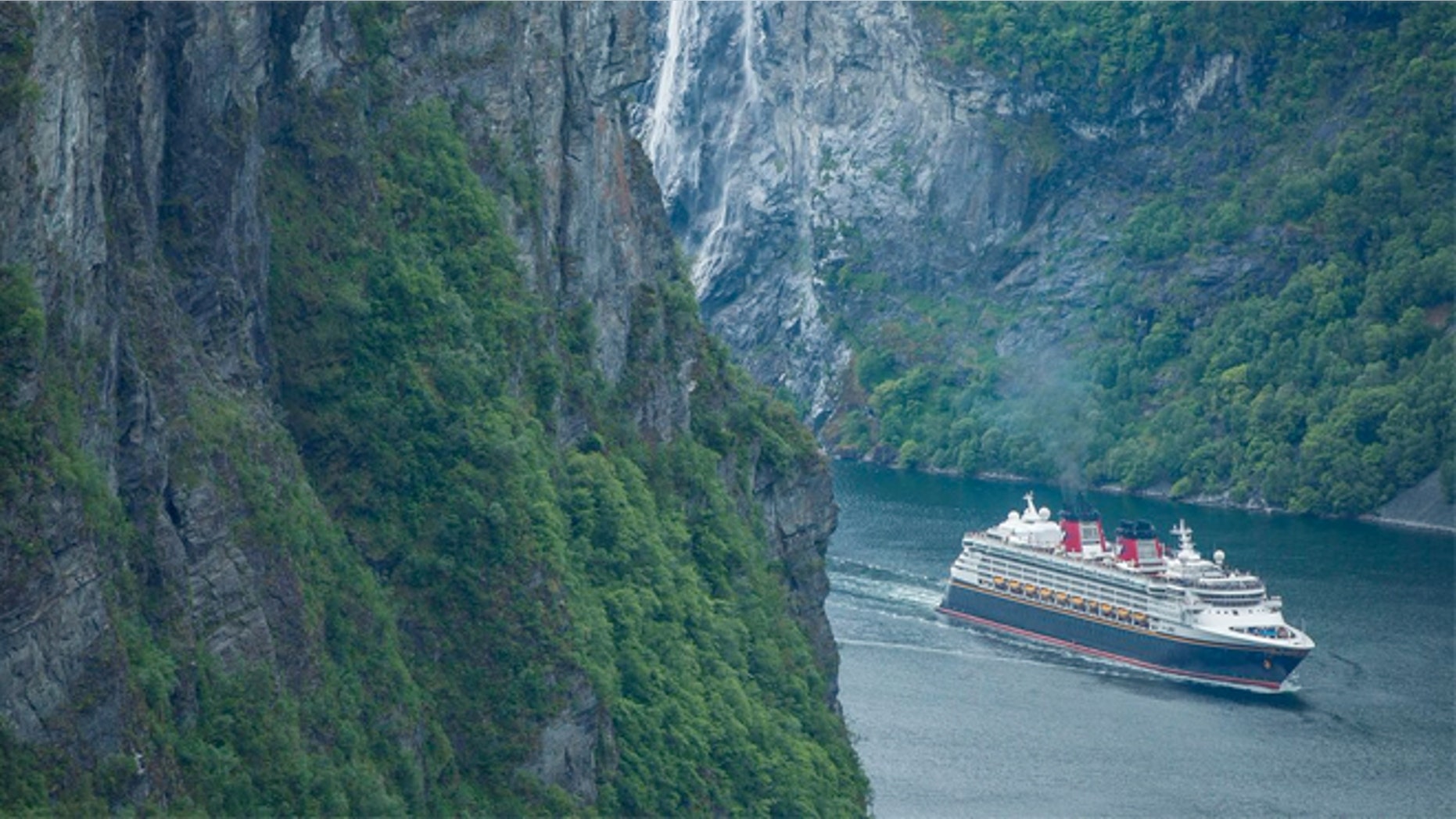 The Disney Magic arrives in Geiranger, Norway, for the first time, sailing through the UNESCO World Heritage Site of Geirangerfjord.