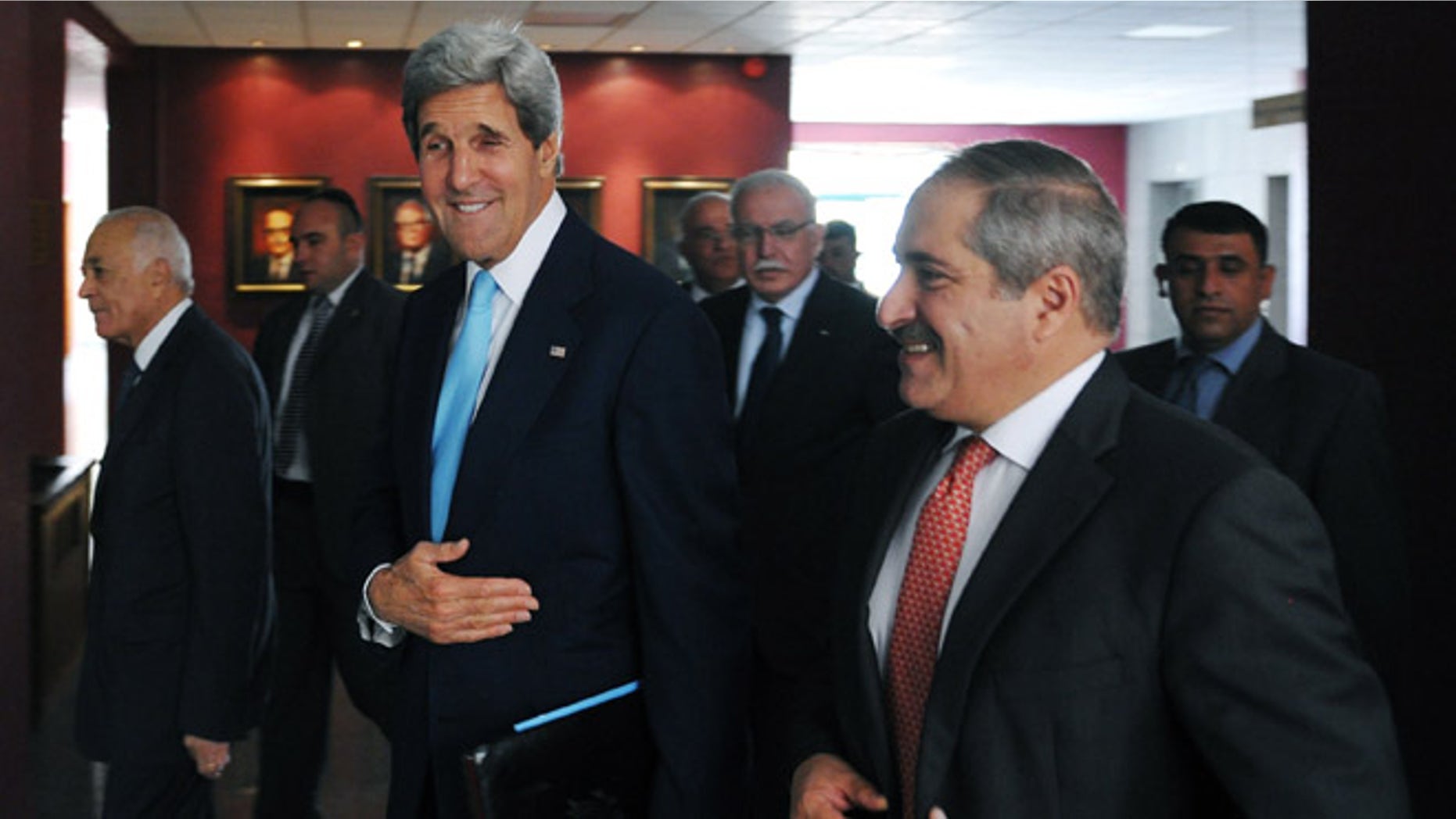 July 17, 2013: U.S. Secretary of State John Kerry, center, Jordan's Foreign Minister Nasser Judeh, right, and Egypt's Foreign Minister Mohammed Kamel Amr, left, arrive for a meeting with the Arab League Peace Initiative at the Ministry of Foreign Affairs in Amman, Jordan.