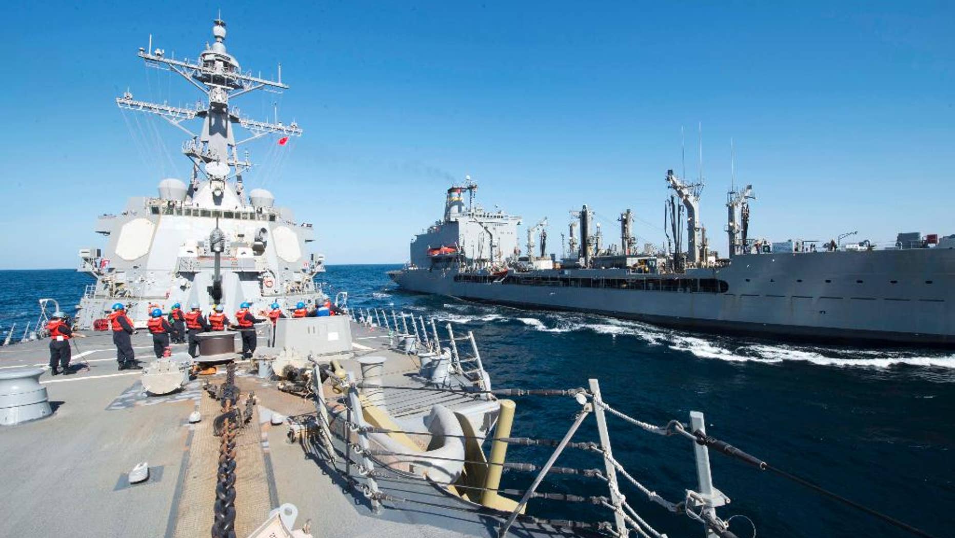 Dec. 24, 2015: Guided-missile destroyer USS Bulkeley participates in a replenishment-at-sea with fleet replenishment oiler USNS John Lenthall in the Gulf of Oman. (Mass Communication Specialist 2nd Class M. J. Lieberknecht/ U.S. Navy via AP)