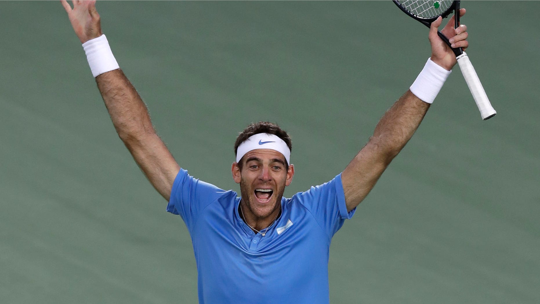 Juan Martin del Potro, of Argentina, drops to the court as he celebrates his victory over Rafael Nadal, of Spain, during their semi-final round match at the 2016 Summer Olympics in Rio de Janeiro, Brazil, Saturday, Aug. 13, 2016. (AP Photo/Charles Krupa)