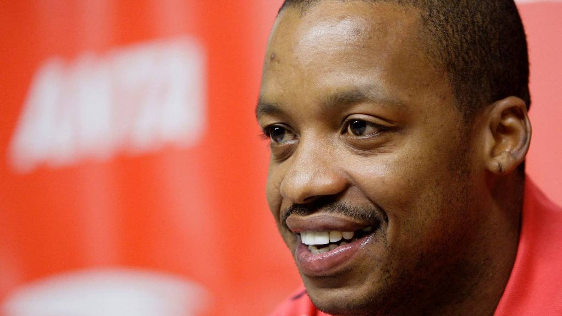 FILE - In this Oct. 17, 2007, file photo, Houston Rockets' Steve Francis smiles during a news conference announcing an endorsement deal with ANTA Sports Products Limited, a company based in China, in Houston. Prosecutors say Francis was arrested Saturday, Nov. 19, 2016, in the Houston-area and is charged with retaliation and DWI. (AP Photo/David J. Phillip, File)