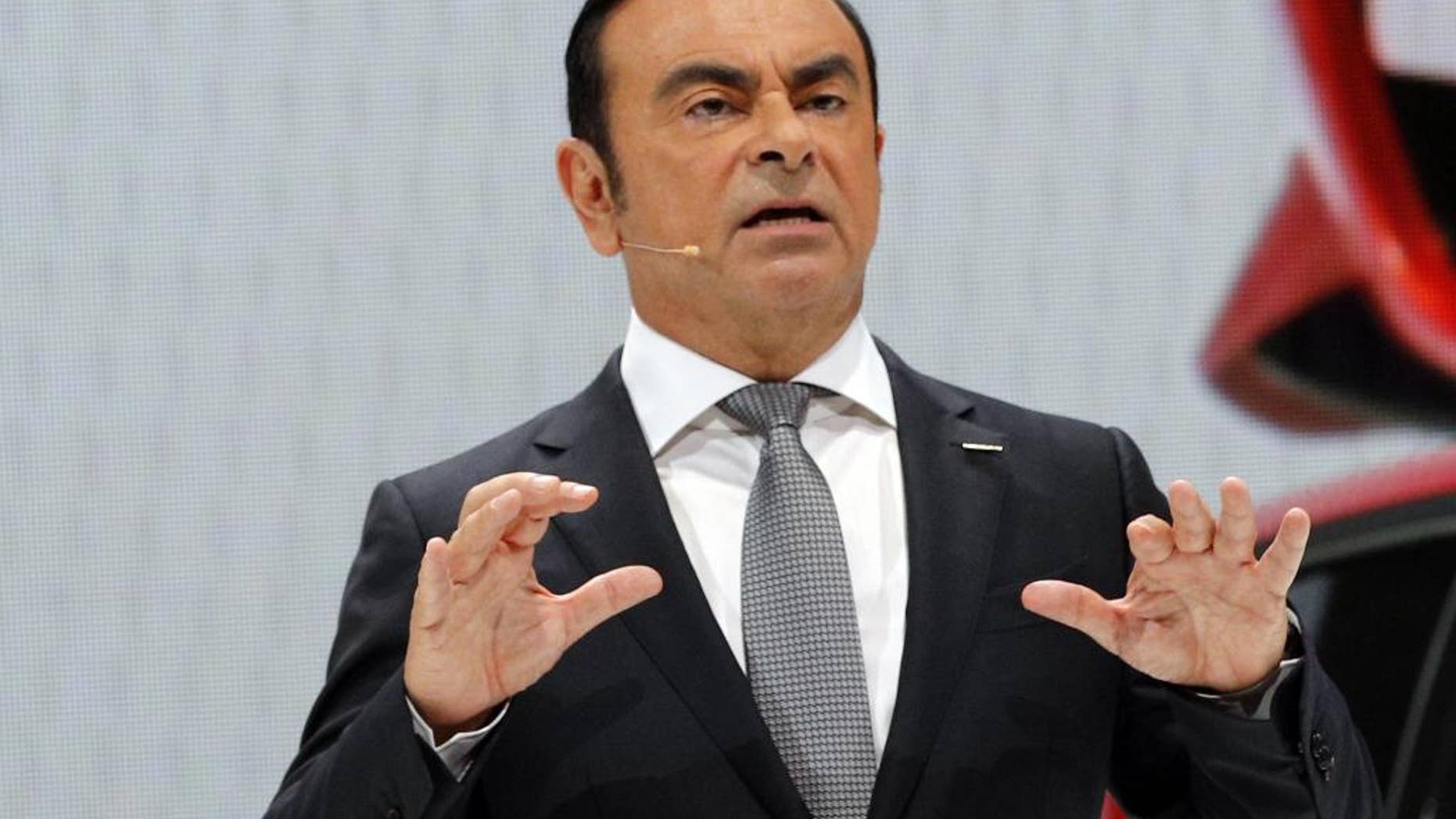 Nissan Motor Co. President and CEO Carlos Ghosn addresses the media during the presentation of the Nissan Micra as part of the first press day at the Paris Auto Show in Paris, France, Thursday, Sept. 29, 2016. The Paris Auto Show will open its gates to the public from Oct. 1st to 16th. (AP Photo/Christophe Ena)
