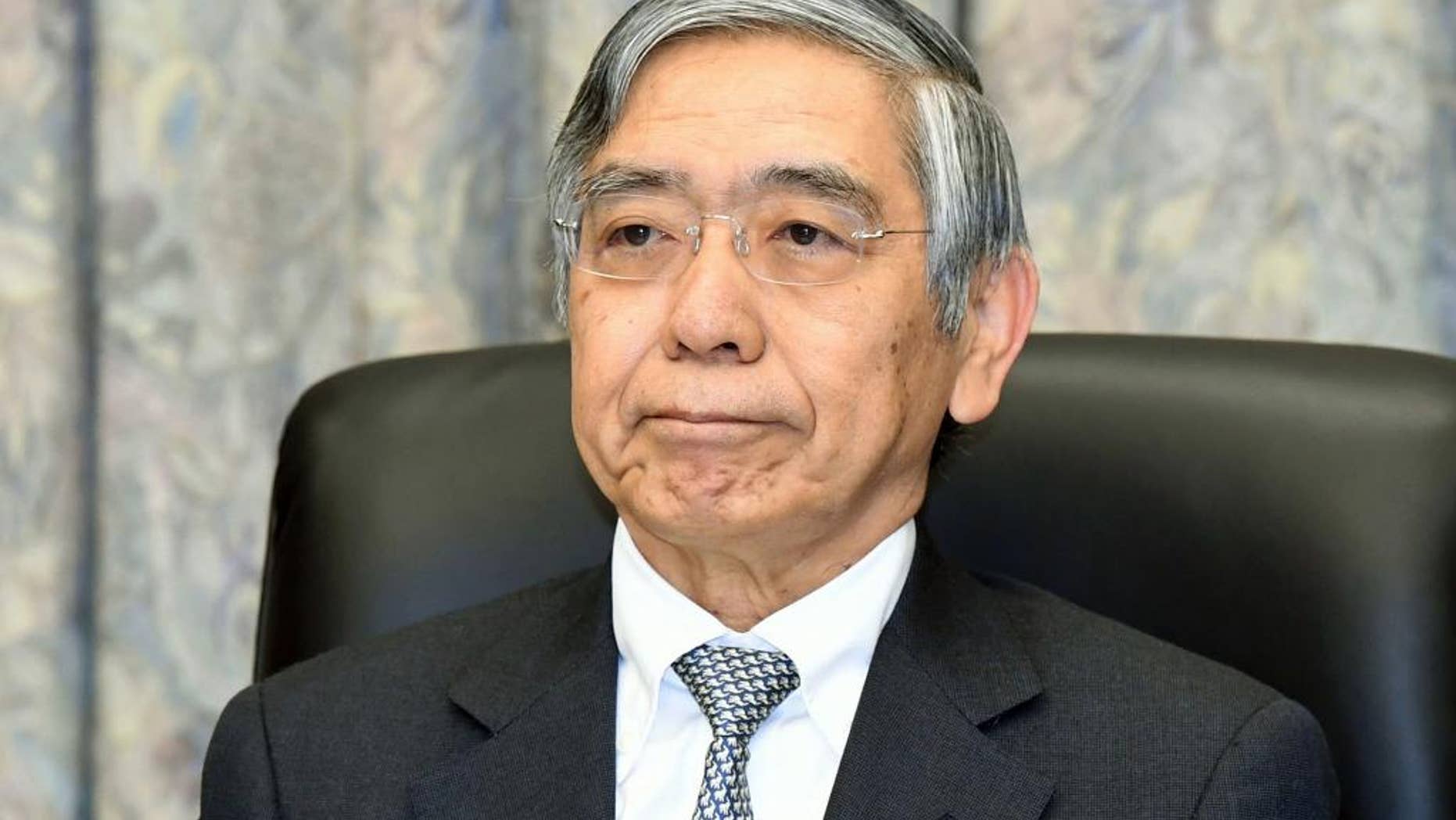 Bank of Japan Gov. Haruhiko Kuroda attends a meeting at the central bank headquarters in Tokyo Tuesday, Dec. 20, 2016. Japan's central bank wrapped up its final meeting of the year Tuesday on an upbeat note, citing signs of improvement in exports, investment and industrial production, while keeping its ultra-lax monetary policy unchanged. (Kyodo News via AP)