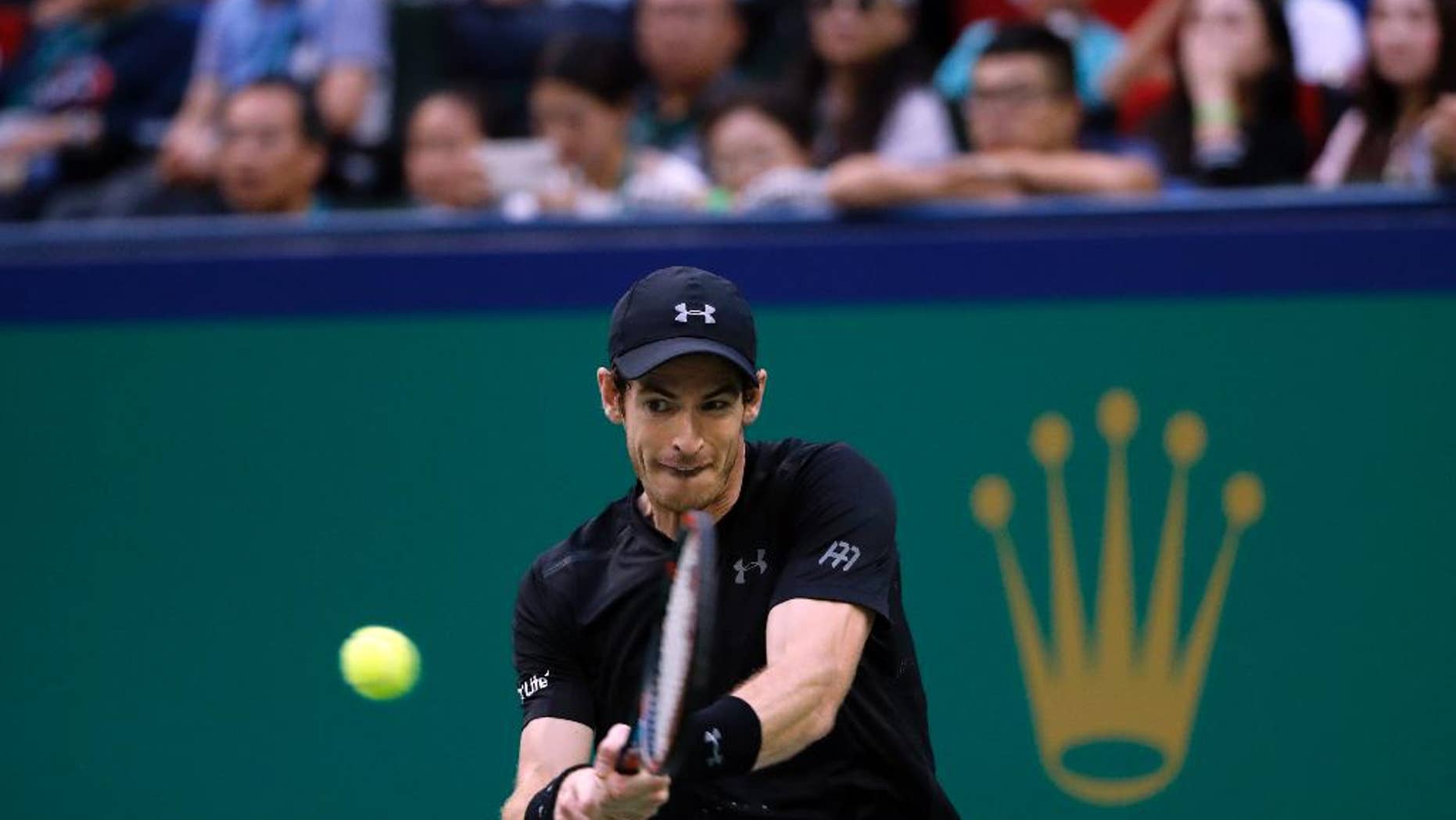 Andy Murray of Britain hits a return shot against Roberto Bautista Agut of Spain during the men's singles final of the Shanghai Masters tennis tournament at Qizhong Forest Sports City Tennis Center in Shanghai, China, Sunday, Oct. 16, 2016. (AP Photo/Andy Wong)