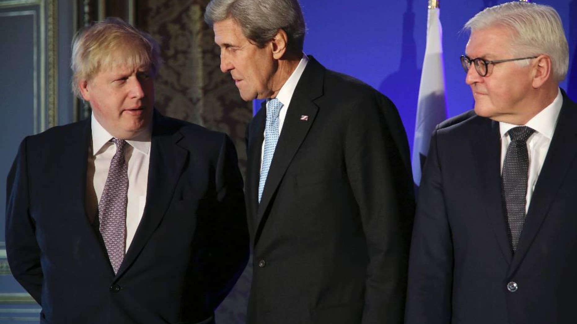 U.S. Secretary of State John Kerry, center, British Foreign Secretary Boris Johnson, left, and German Foreign Minister Frank-Walter Steinmeier, talk during a family picture prior to a meeting, in Paris, Saturday, Dec. 10, 2016. Kerry and leading diplomats are trying to find solutions for Syria's desperate opposition, as Syrian government forces squeeze rebels out of Aleppo after a devastating blitz. (AP Photo/Thibault Camus, Pool)