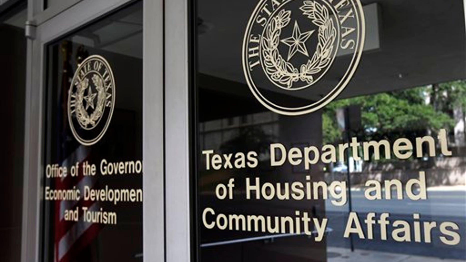 This photo taken Aug. 30, 2014, shows the Texas Department of Housing and Community Affairs in Austin, Texas. Over the past two years, civil rights advocates have managed to prevent the Supreme Court from deciding an issue after the justices agreed to hear a case by coaxing settlements in a pair of high-profile housing discrimination cases weeks before the court was set to hear oral arguments. Those last-minute settlements may have pushed the issue down the road but the court could decide as early as this month whether to take up another disparate impact case, in which Texas officials are accused of racial bias for steering low-income housing into mostly black neighborhoods. (AP Photo/Eric Gay)