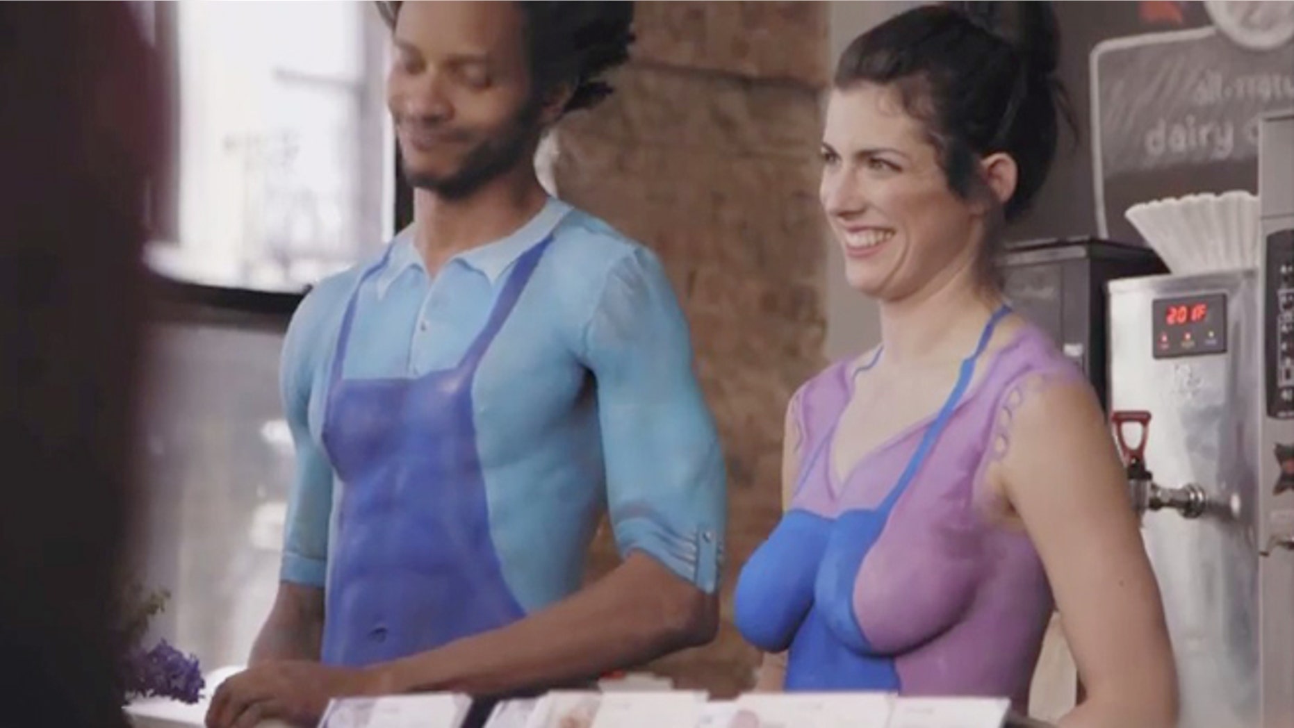 Naked baristas serve surprised patrons coffee in Nestle's new commercial.