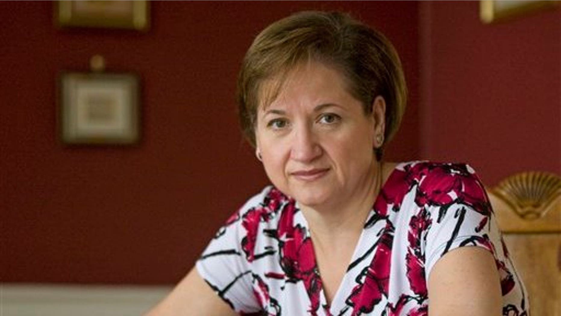 Cristina Iaboni poses for a portrait in her home in Bethany, Conn. Iaboni, a diabetic, has found a doctor who is testing weight loss surgery on diabetics who are merely overweight or a tad obese in an attempt to curb the chronic disease. Scientists in recent years have discovered that diabetes all but disappeared in some obese patients soon after the operation. Many were able to achieve normal blood sugar and ditch their medications.