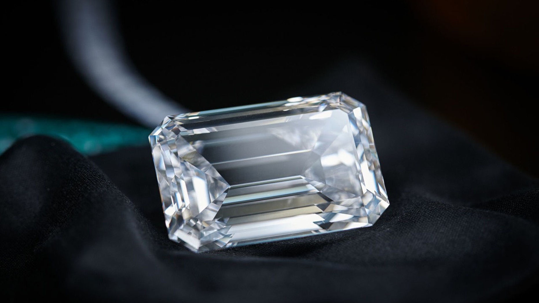 In this image released on Thursday, Sept. 28, 2017, a 163-carat flawless emerald stone, the largest of its kind ever to be put up for auction, has been unveiled in Hong Kong today. The finished piece, named The Art of de Grisogono will be presented in a series of public viewings around the world before it goes up for an auction at Christie's in Geneva on November 14.
