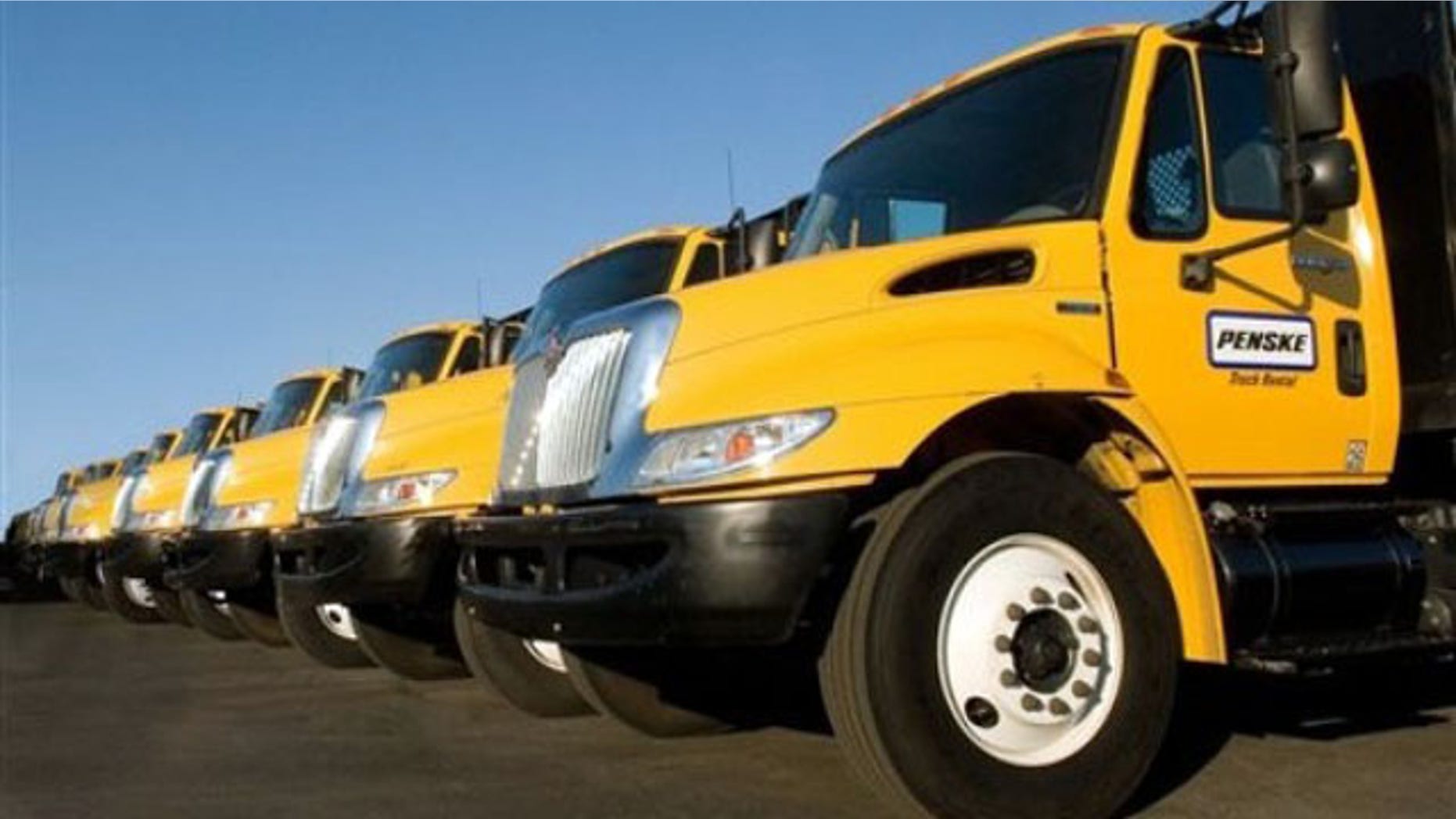 Diesel-powered flatbed trucks from Penske Corp.