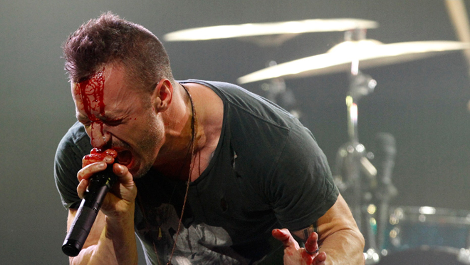 Greg Puciato of the Dillinger Escape Plan performing. The band were involved in a bus accident in Poland.