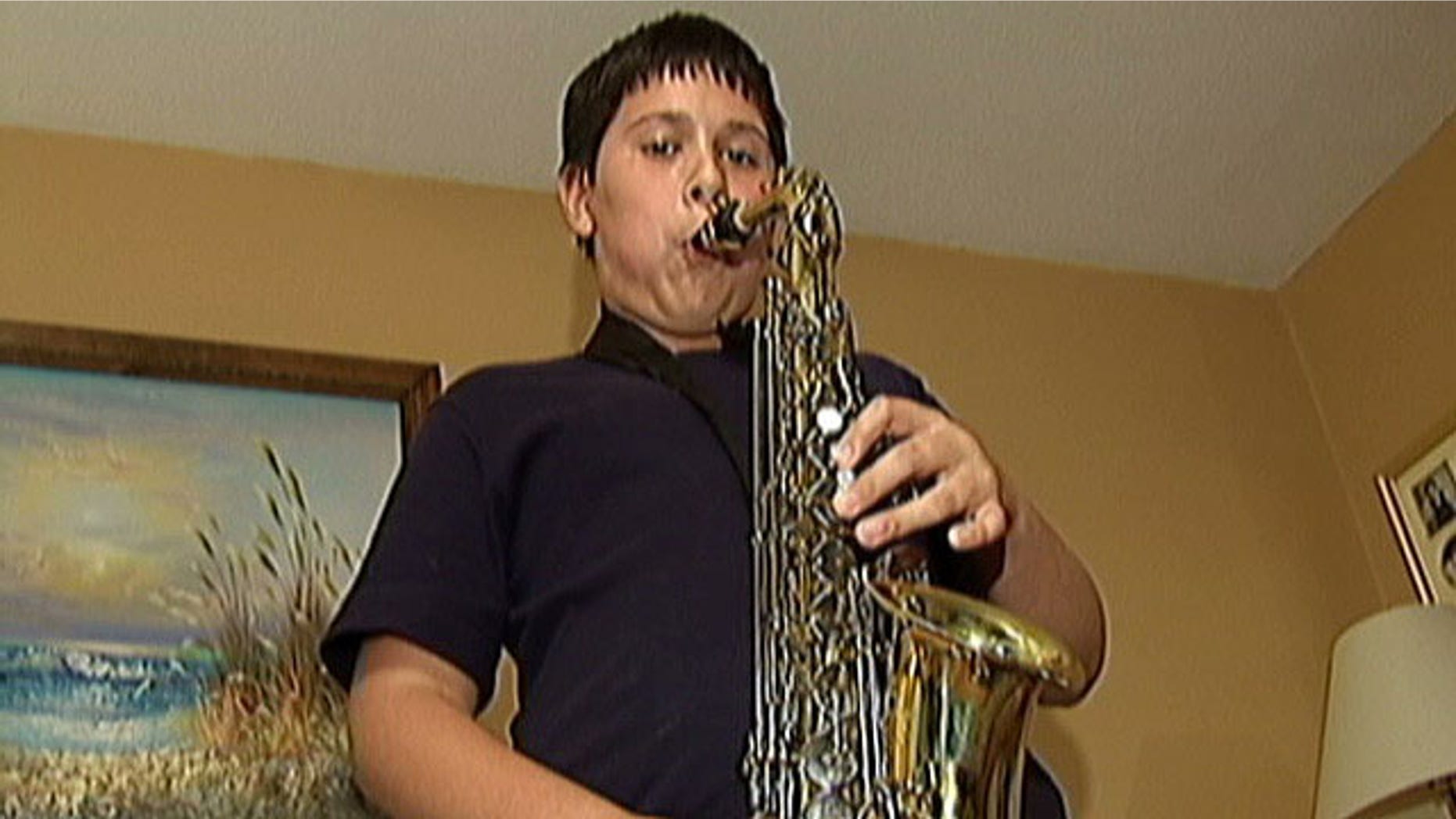 Cathy DiMarzio, of Raynham, said her son Andrew, seen above, was recently told that his 31-inch by 12-inch saxophone case would no longer be allowed on Bus 9 within the Bridgewater-Raynham Regional School District because the bus is filled to capacity and the instrument creates a safety hazard.