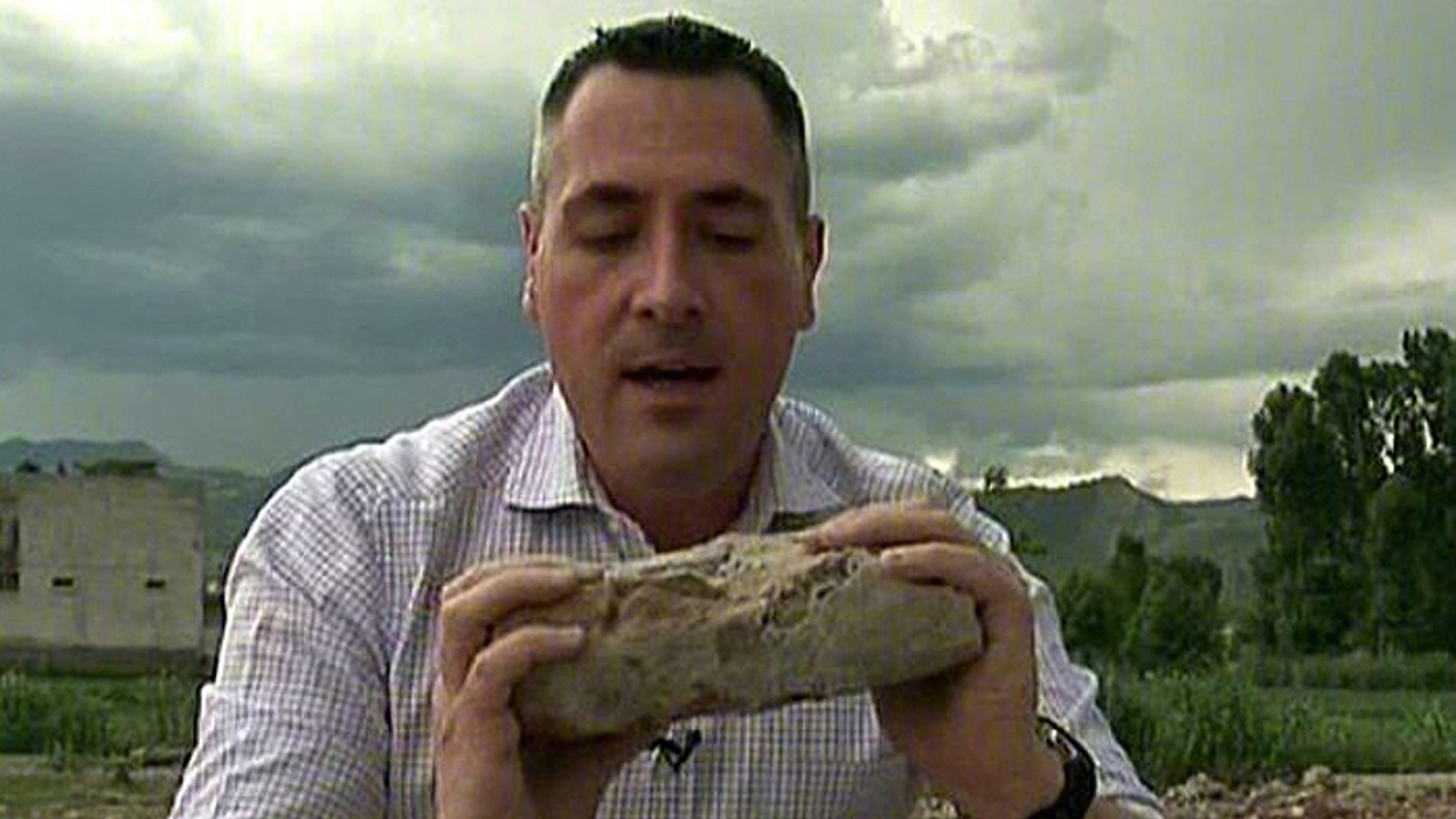 Di-Natale's reporting took him to Pakistan, where he is shown here holding a piece of Usama bin Laden's compound after Navy SEALs killed the terror boss. (Fox News Channel)