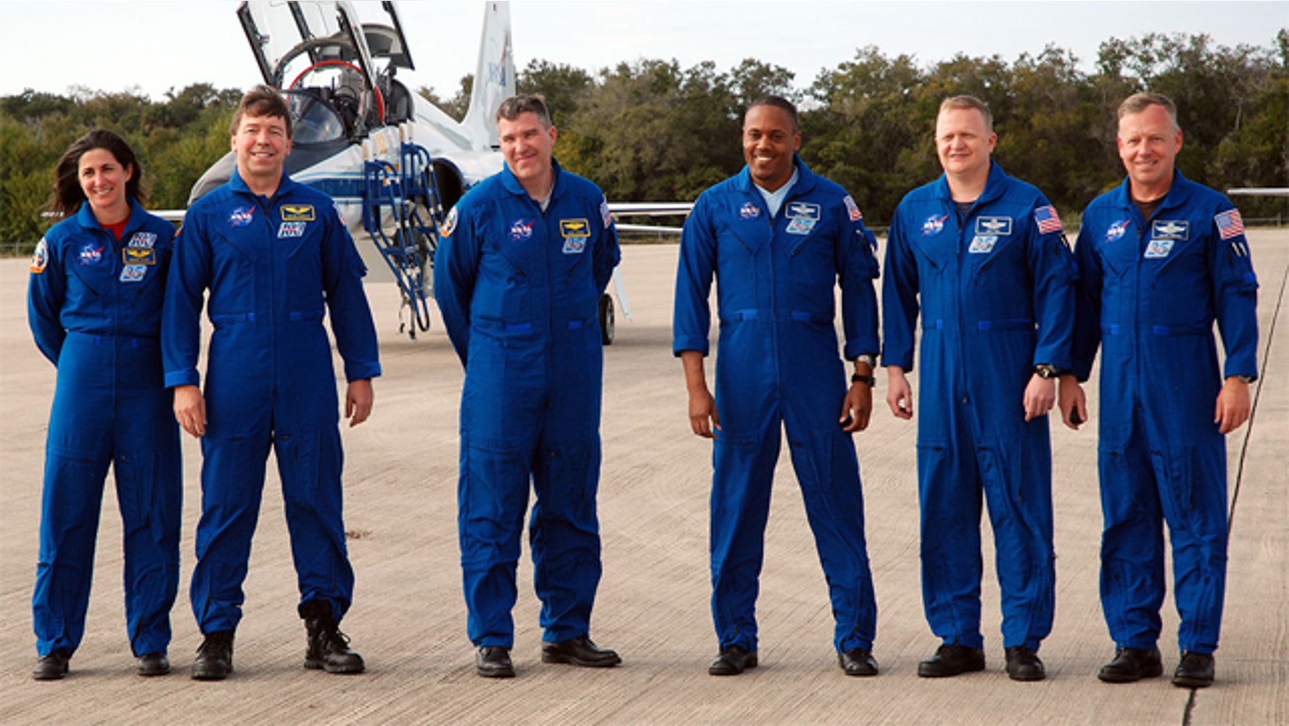 Space shuttle Discovery's STS-133 crew arrives at NASA's Kennedy Space Center on Feb. 20, 2011. From left: Nicole Stott, Michael Barratt, Steve Bowen, Al Drew, Eric Boe and Steven Lindsey.