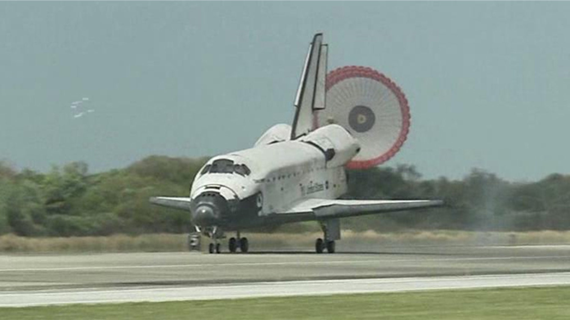 Space shuttle discovery rolls to its final landing at Kennedy Space Center in Florida.