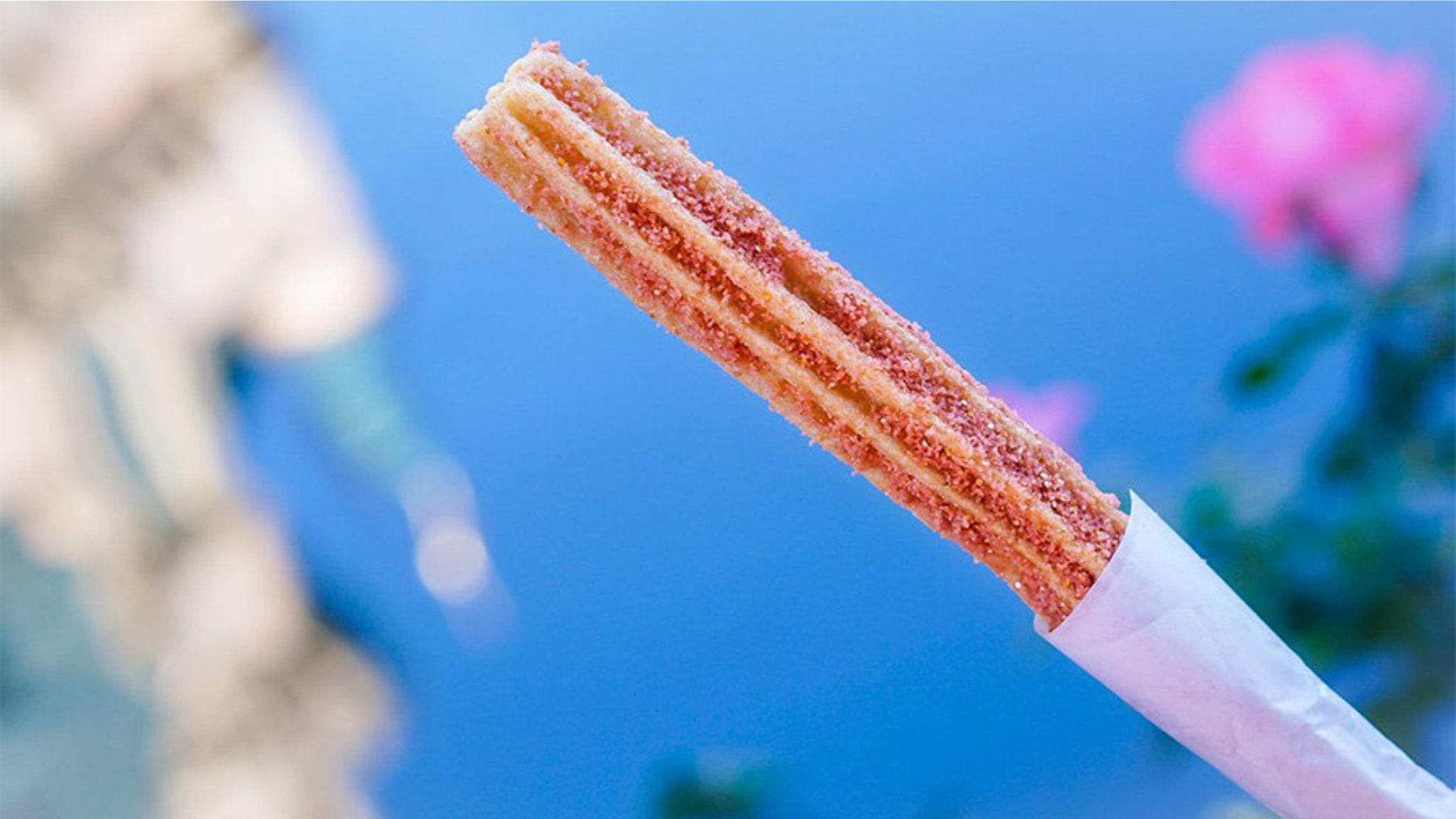 Disneyland has given rose gold fans a new treat to obsess over -- churros covered in sparkly pink-hued sugar crystals.