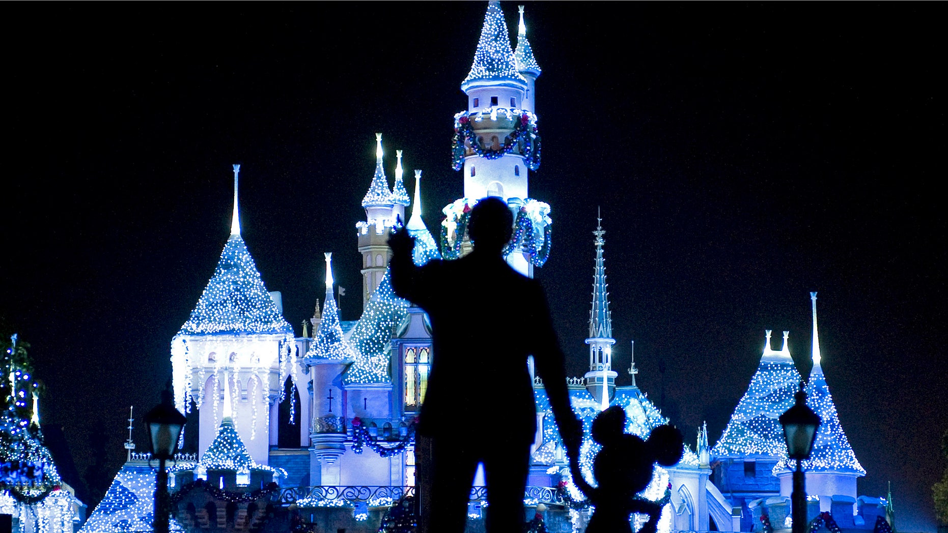 Nov. 20, 209: Sleeping Beauty's Castle in winter dress with the iconic "Partners" statue featuring images of Walt Disney and Mickey Mouse in the foreground, at Disneyland in Anaheim, Calif.