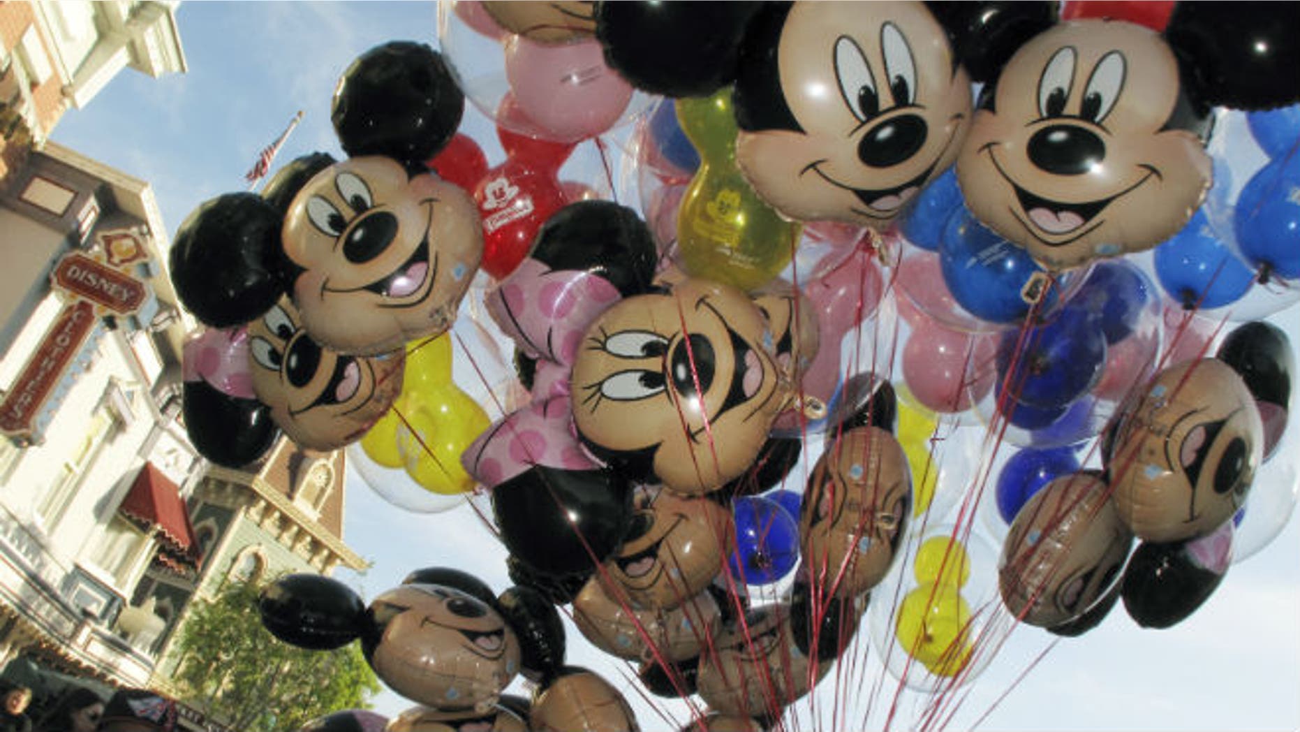 Balloons of Mickey Mouse are carried down main street at Disneyland in Anaheim, California, March 11, 2011. REUTERS/Mike Blake