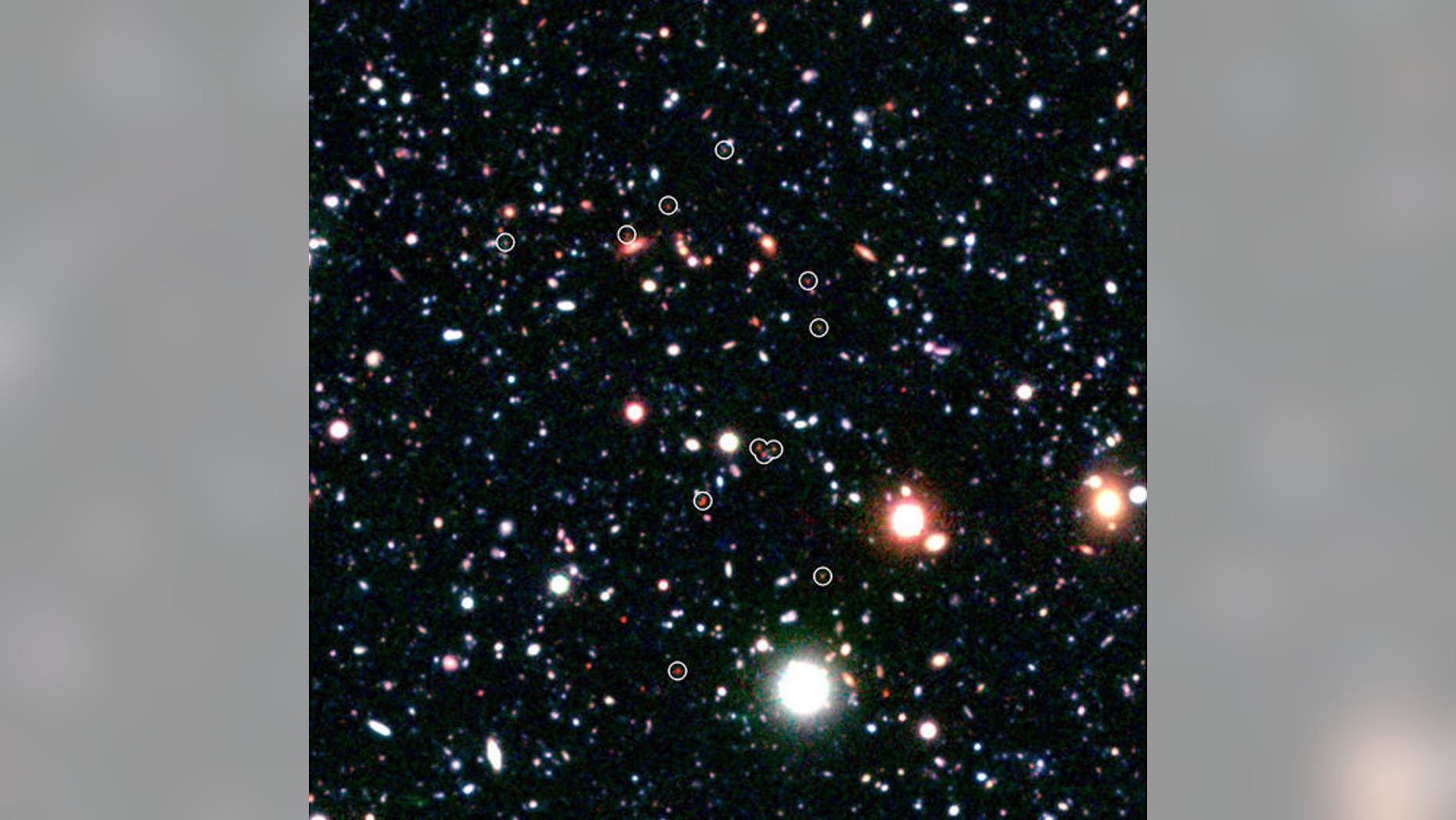 Science vs. religion: Religion proponents say the universe is too finely tuned for life to not involve a god, while science proponents say we know how the universe formed from nothing. Shown here, a group of galaxies forming very early in the u