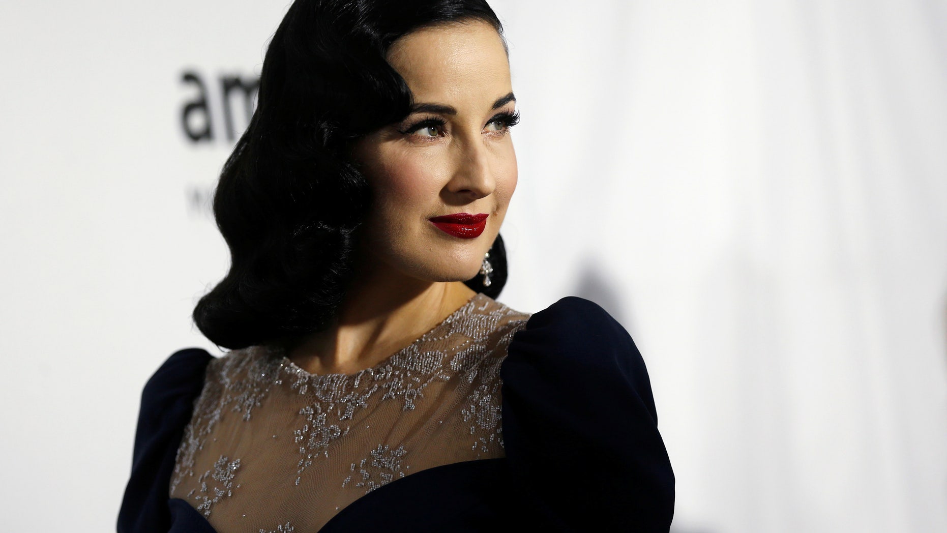Performer Dita Von Teese poses at the 2016 amfAR Inspiration Gala in Los Angeles, California U.S., October 27, 2016. REUTERS/Mario Anzuoni - RTX2QSHY