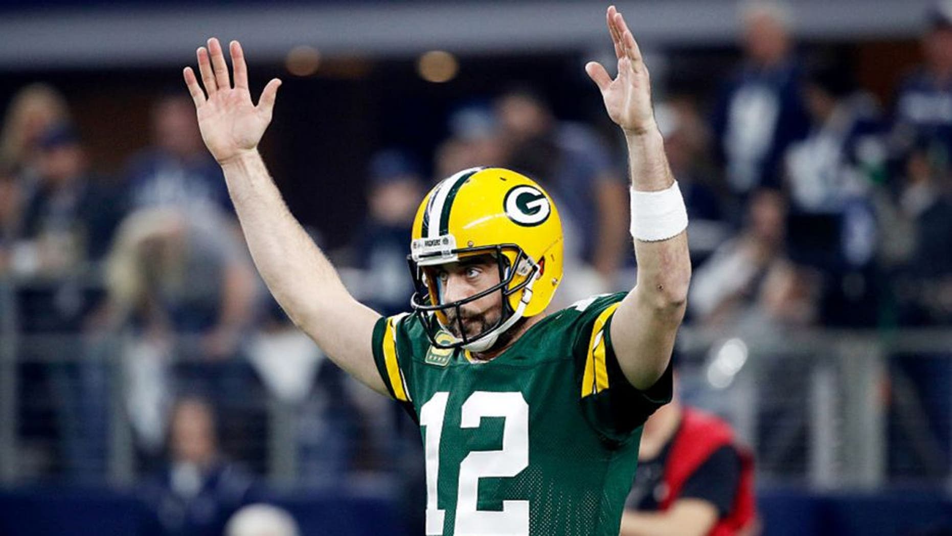 ARLINGTON, TX - JANUARY 15: Aaron Rodgers #12 of the Green Bay Packers reacts after scoring a touchdown in the first half during the NFC Divisional Playoff Game against the Dallas Cowboys at AT&T Stadium on January 15, 2017 in Arlington, Texas. (Photo by Joe Robbins/Getty Images)