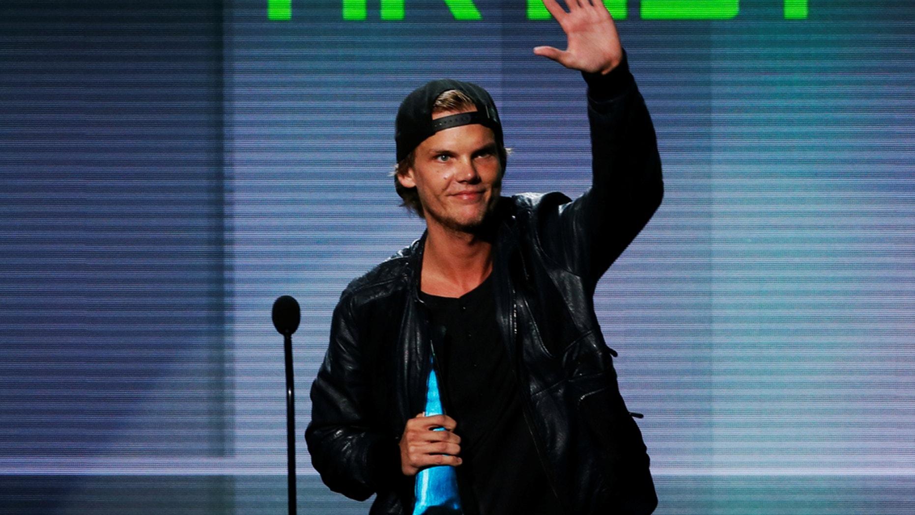 Avicii accepts the favorite electronic dance music artist award at the 41st American Music Awards in Los Angeles, California November 24, 2013.