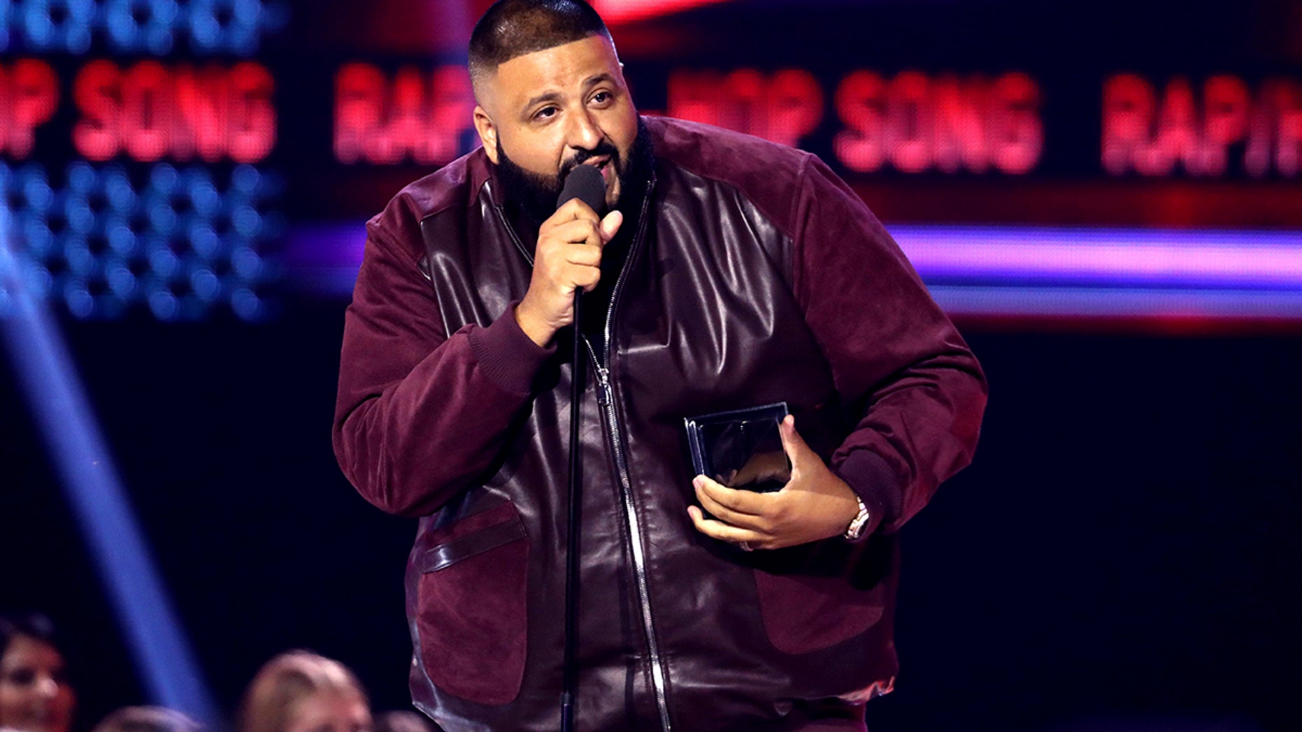 FILE - In this Sunday, Nov. 19, 2017, file photo, DJ Khaled accepts the award for favorite song rap/hip-hop for "I'm the One" at the American Music Awards at the Microsoft Theater in Los Angeles. Weight Watchers International climbed after it struck a deal with producer and recording artist DJ Khaled, who will represent the brand to millions of follows on Snapchat, Twitter, Instagram and Facebook. (Photo by Matt Sayles/Invision/AP, File)