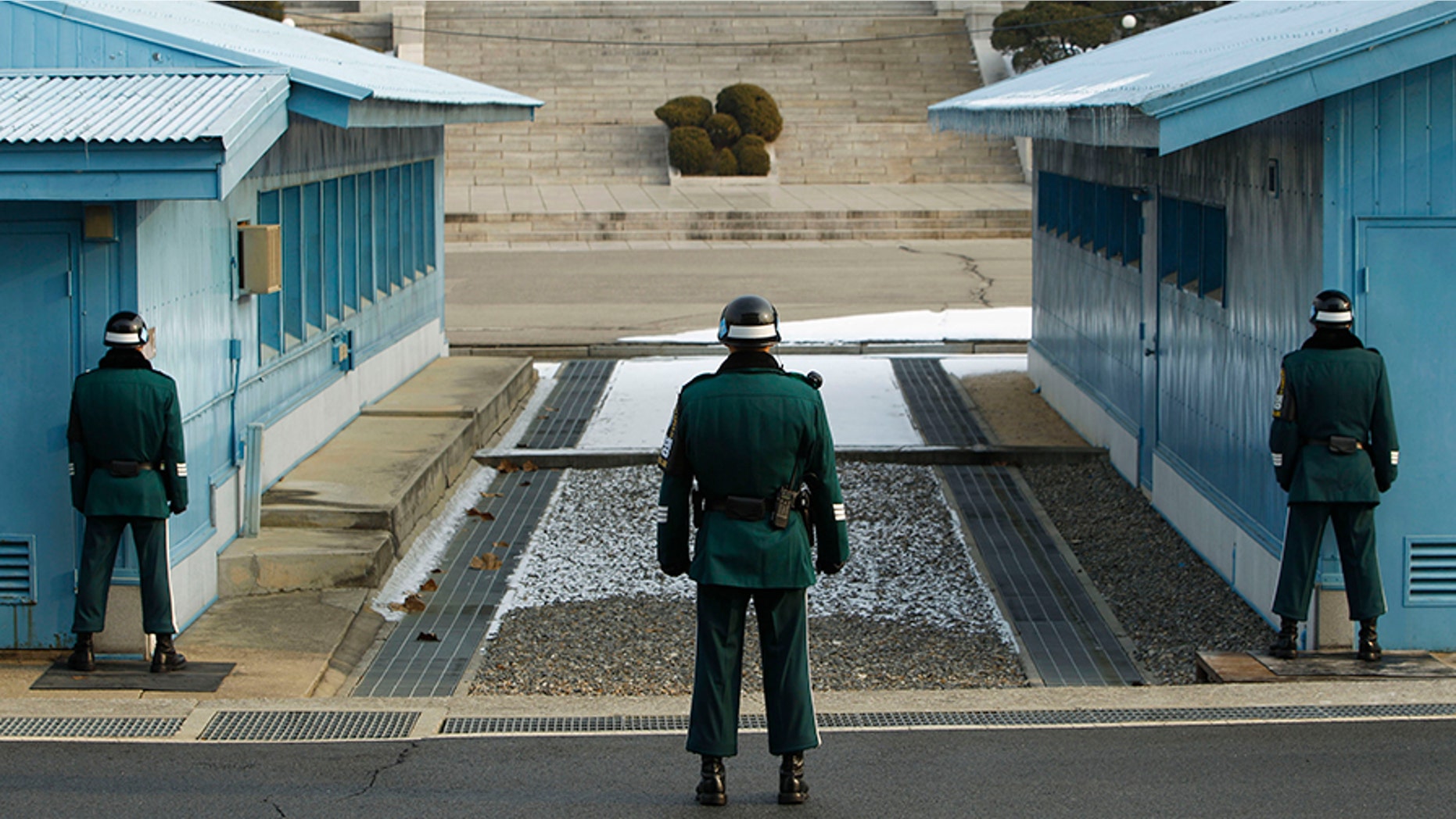 A South Korean soldier stands guard as he faces the North Korea side at the border village of Panmunjom in the demilitarized zone (DMZ) separating the two Koreas, Dec. 28, 2011.