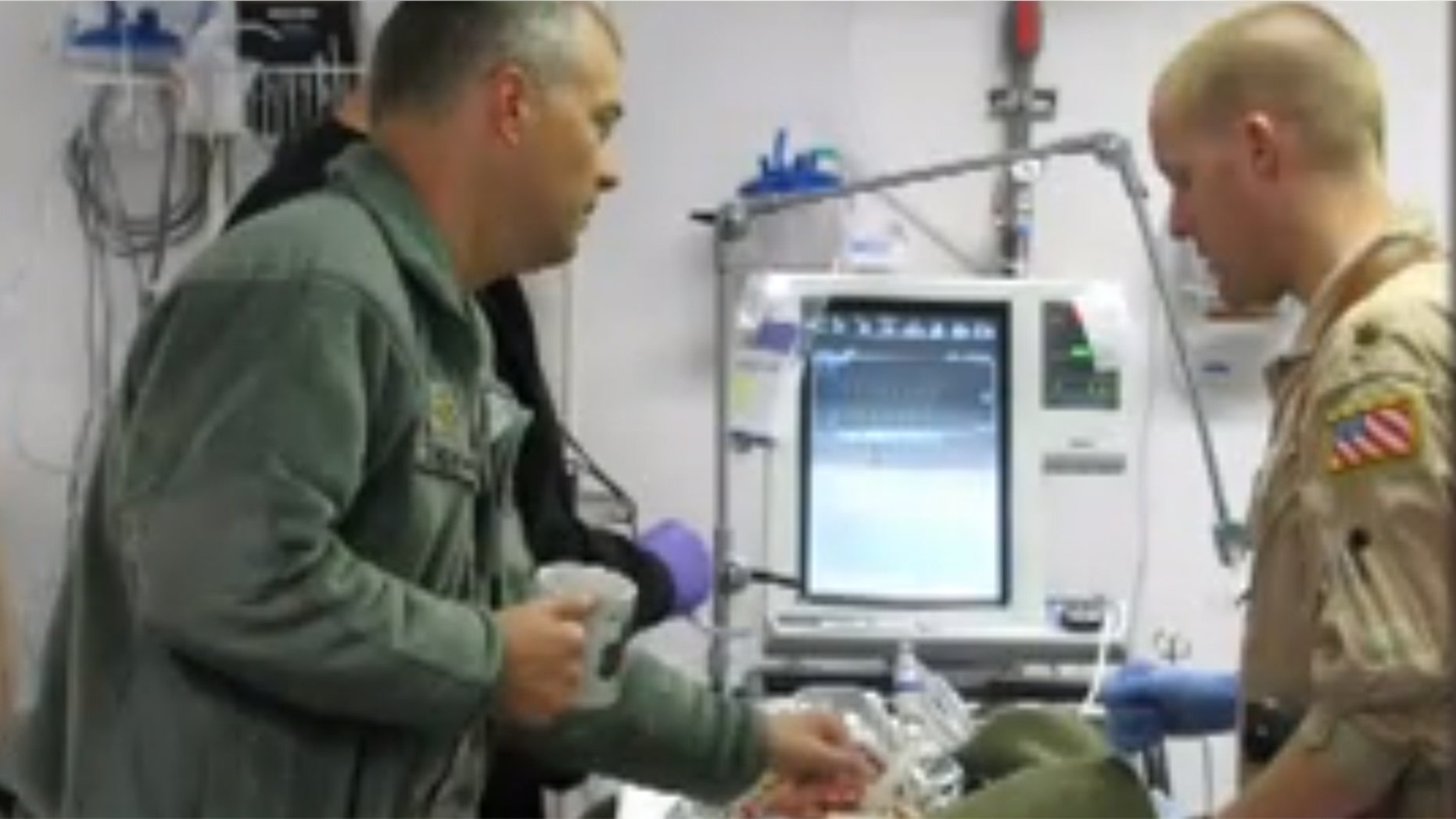 Army Lt. Colonel John Chovanes, a trauma doctor at Cooper University Hospital, is pictured above left.