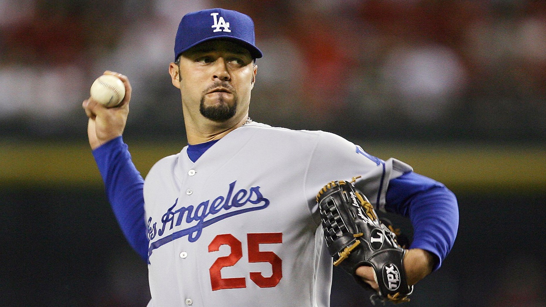 FILE Sept. 21, 2007: Los Angeles Dodgers' Esteban Loaiza, of Mexico, throws a pitch against the Arizona Diamondbacks in the first inning of a baseball game in Phoenix. Former All-Star pitcher Loaiza - who earned a total of more than $43 million over 14 seasons - is heading to court accused of drug dealing involving 20 kilograms (44 pounds) of suspected cocaine. The 46-year-old retired Major League Baseball player is scheduled to appear in court in Chula Vista, Calif., south of San Diego, on Wednesday, Feb. 14, 2018.