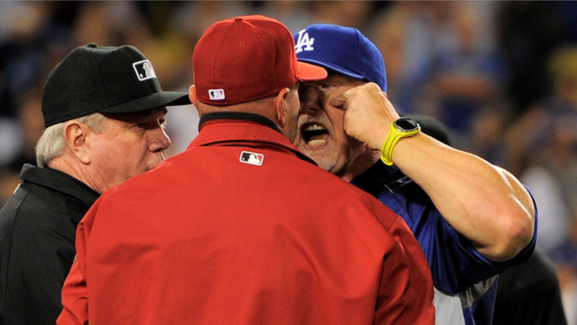 June 11, 2013: Los Angeles Dodgers batting coach Mark McGwire, right, yells at Arizona Diamondbacks manager Kirk Gibson after Los Angeles Dodgers' Zack Greinke was hit by a pitch during the seventh inning of their baseball game in Los Angeles. (AP/Mark J. Terrill)