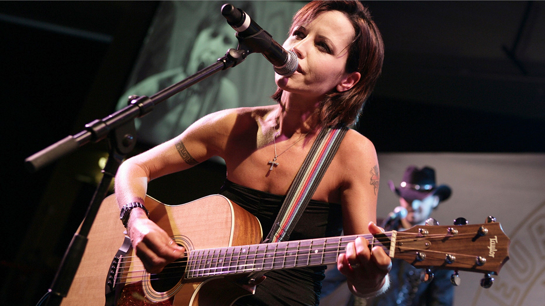 Beside Dolores O'Riordan's casket was a bouquet of flowers inscribed with lyrics from the band's hit “Linger” that read, "The song has ended, but the memories linger on."