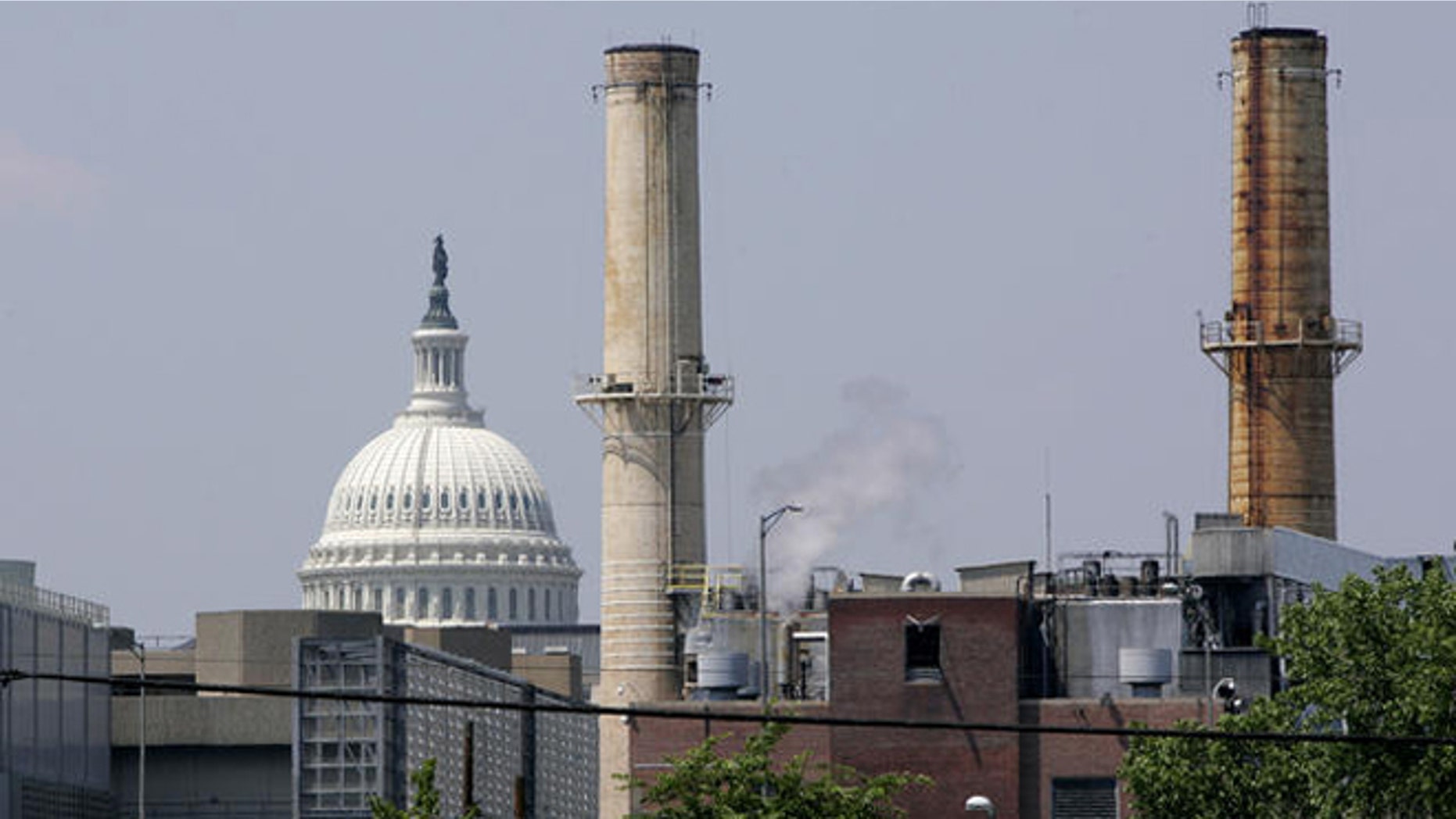 Coal-fired power plants are seen with the U.S. Capitol looming in the background.